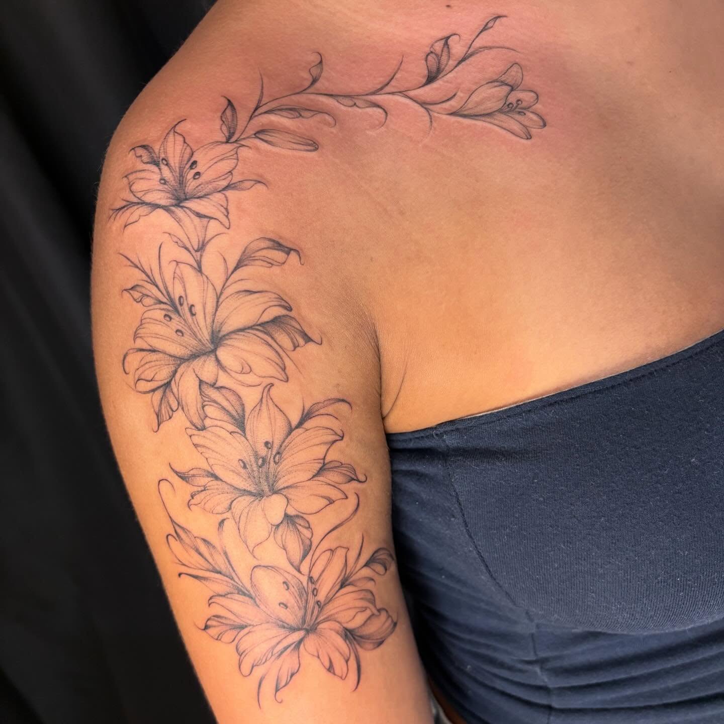 Lilies black and grey tattoo on the shoulder by ꩜ 𖦹