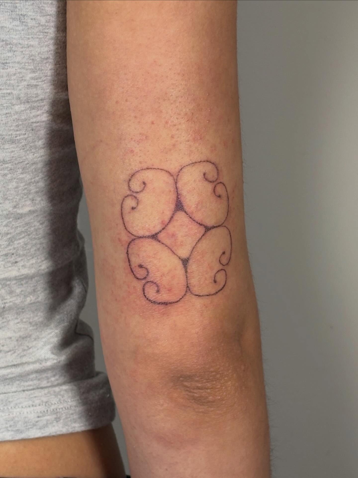 Swirls geometric tattoo on the forearm by Jill
