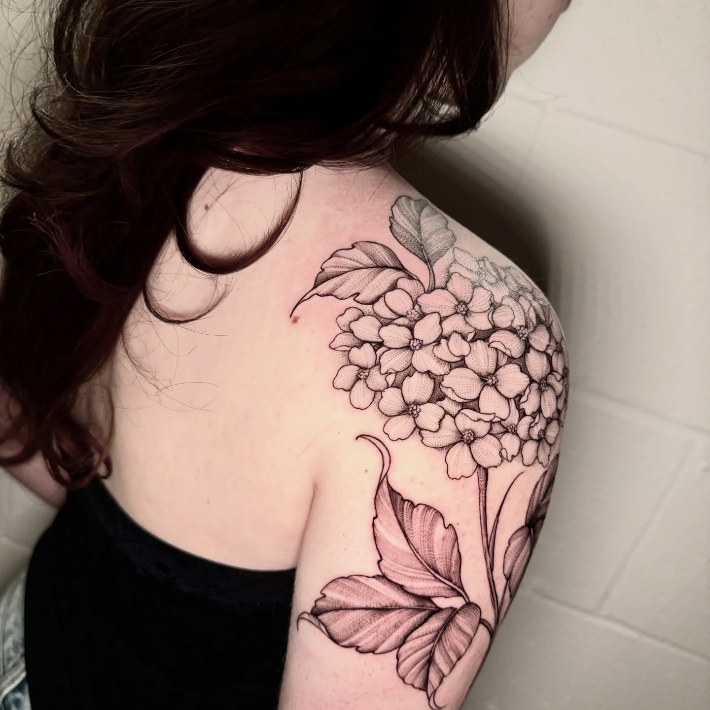 Hydrangea black and grey tattoo on the shoulder by ℳ𝒾𝓇𝓉𝒽𝒶 𝒯ℴ𝓇𝓇ℯ𝓈, San Diego, California