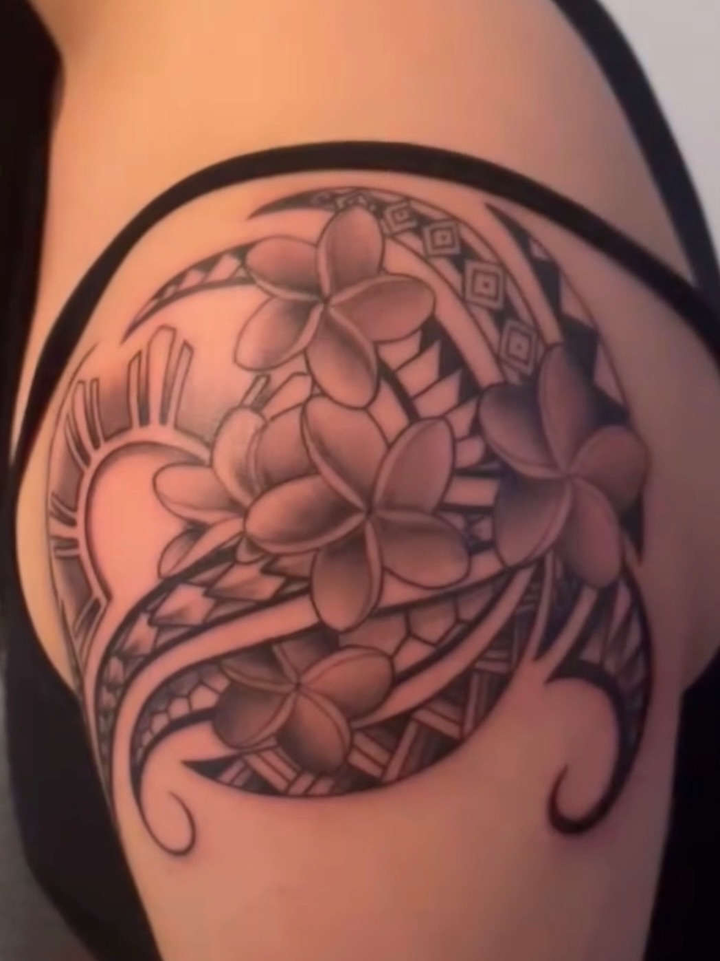 Plumeria flowers geometric tattoo on the shoulder by Erik Pagtakhan