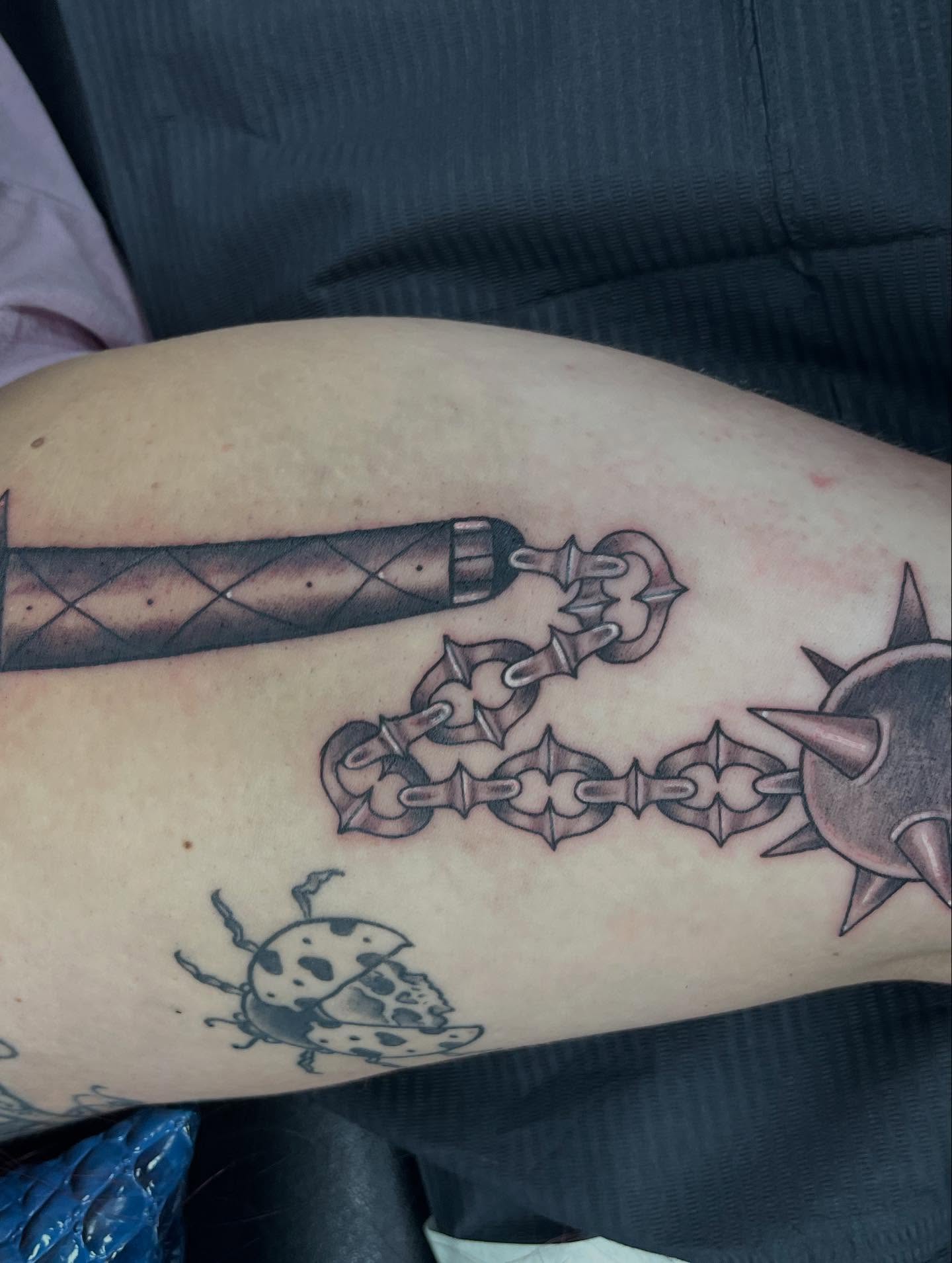 Chainmail armor black and grey tattoo on the thigh by @artinjections667