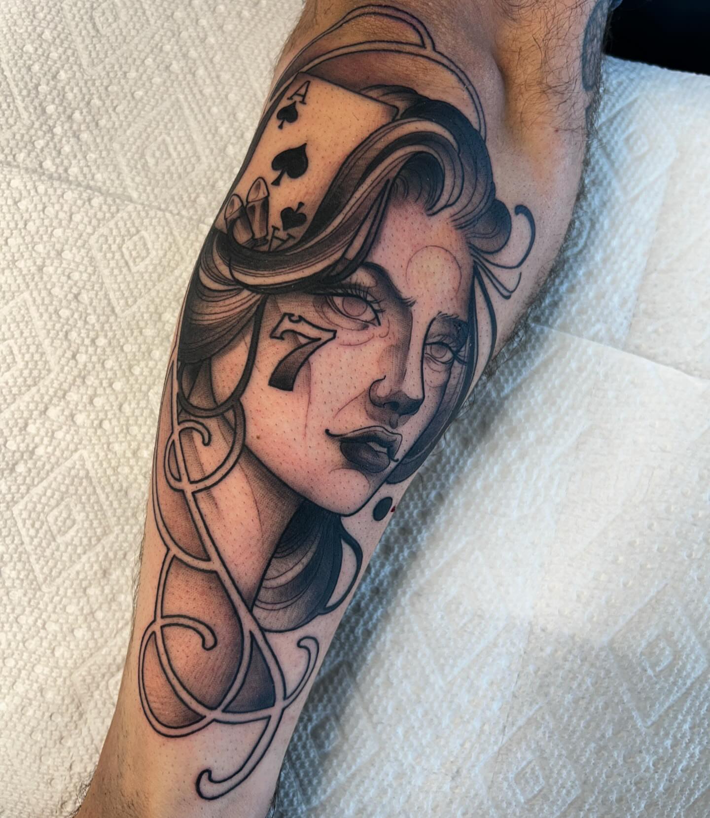 Woman with playing card dotwork tattoo on the forearm by Kayla Fay, Baton Rouge, Louisiana