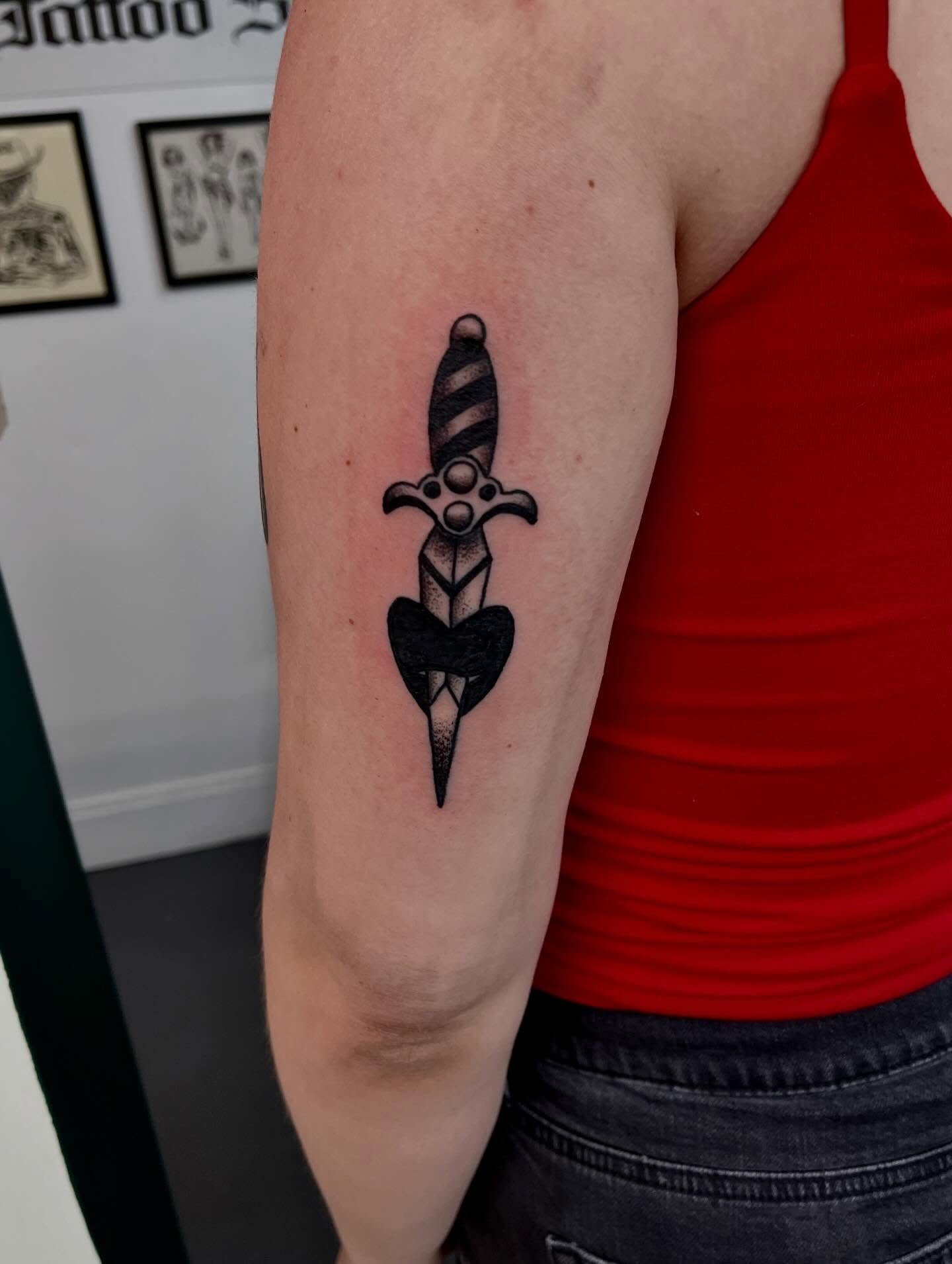 Sword black and grey tattoo on the forearm by Mason McCubbin