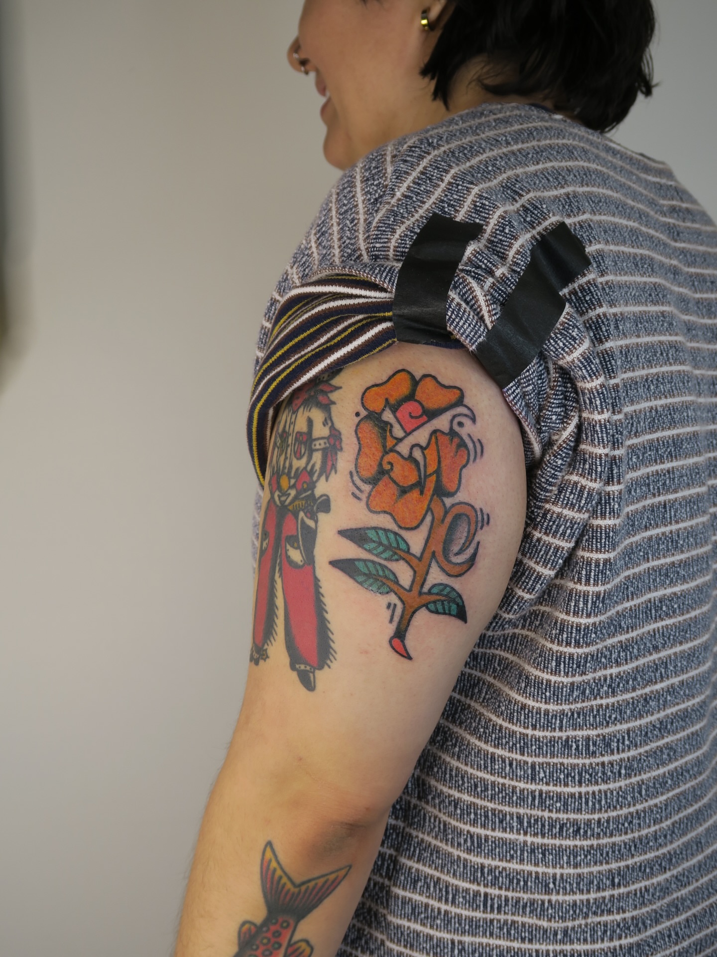 Flower and figure American traditional tattoo on the shoulder by Roman