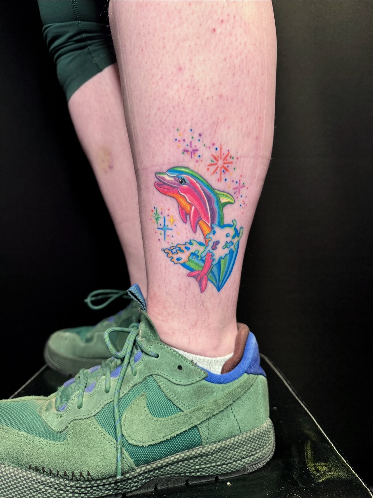 Dolphin dotwork tattoo on the calf by aria, Austin, Texas