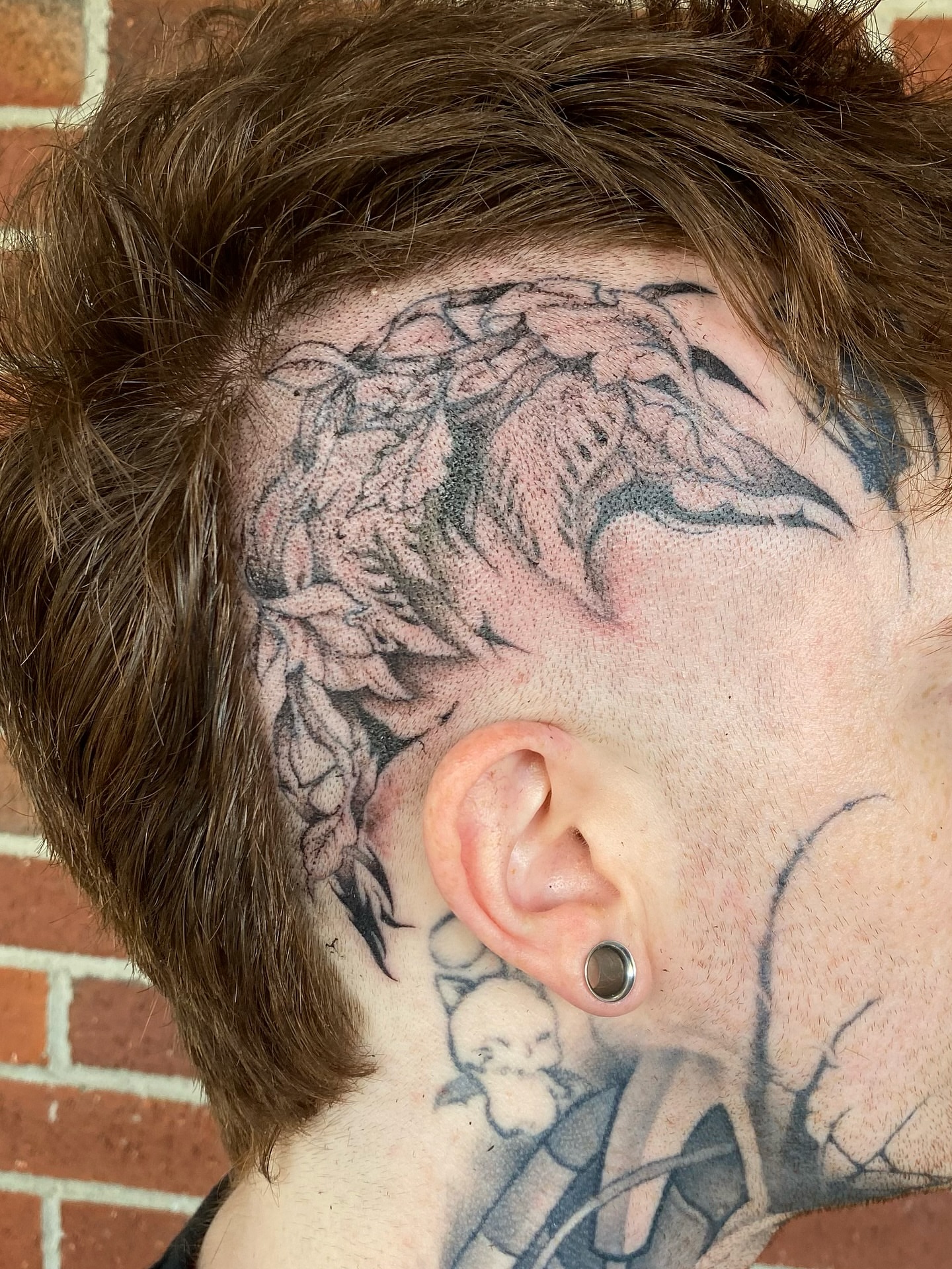 Wings and leaves black and grey tattoo on the neck by 𝙅𝙤𝙧𝙙𝙖𝙣 𝙏𝙝𝙞𝙗𝙚𝙙𝙚𝙖𝙪