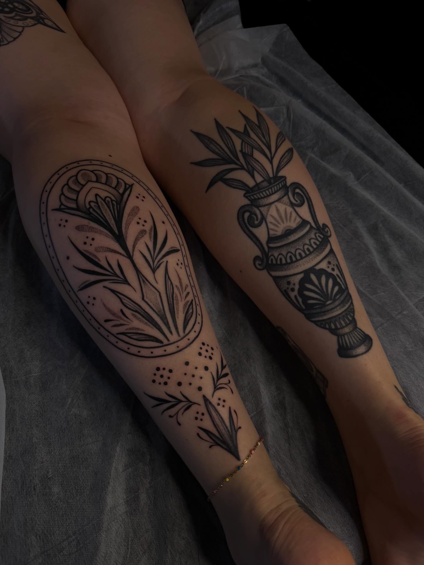 Floral arrangement black and grey tattoo on the forearm by Allison