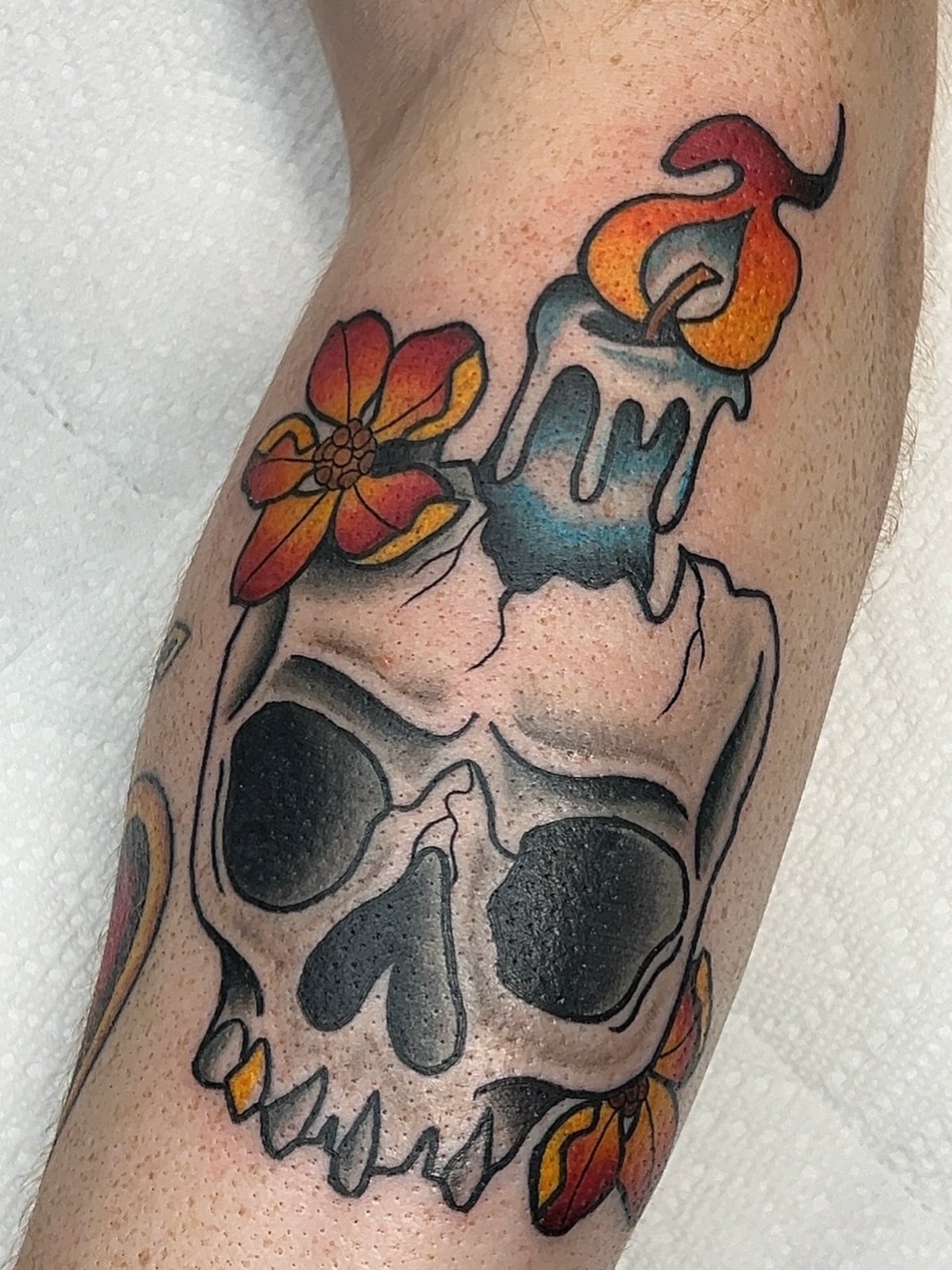 Skull with candle and flower American traditional tattoo on the forearm by 𝑴𝒂𝒚𝒂𖤐𝑫𝒆𝑽𝒊𝒏𝒆, Dayton, Ohio