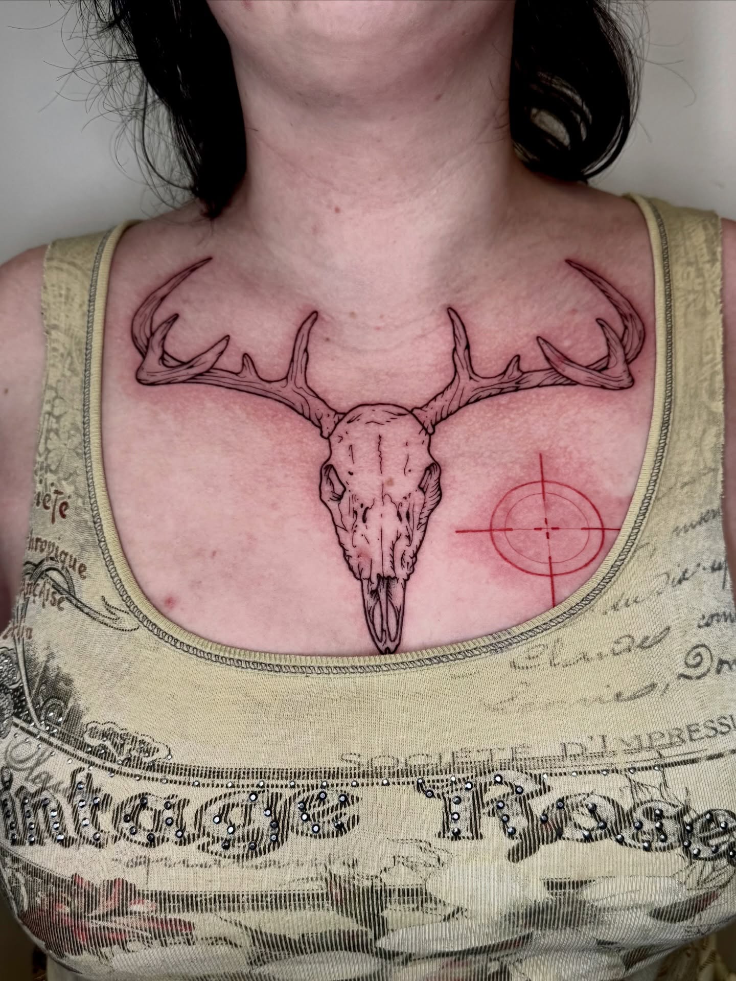 Deer skull realism tattoo on the chest by Ian Saner