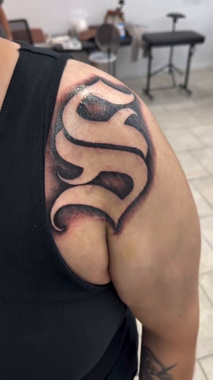 Letter S Chicano tattoo by Daniel Lopez Tattoos