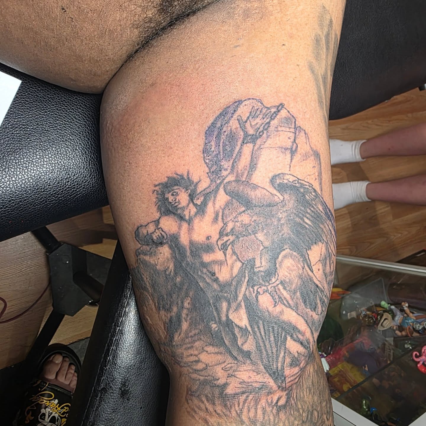 Hercules and centaur black and grey tattoo on the thigh by Rusty Williams