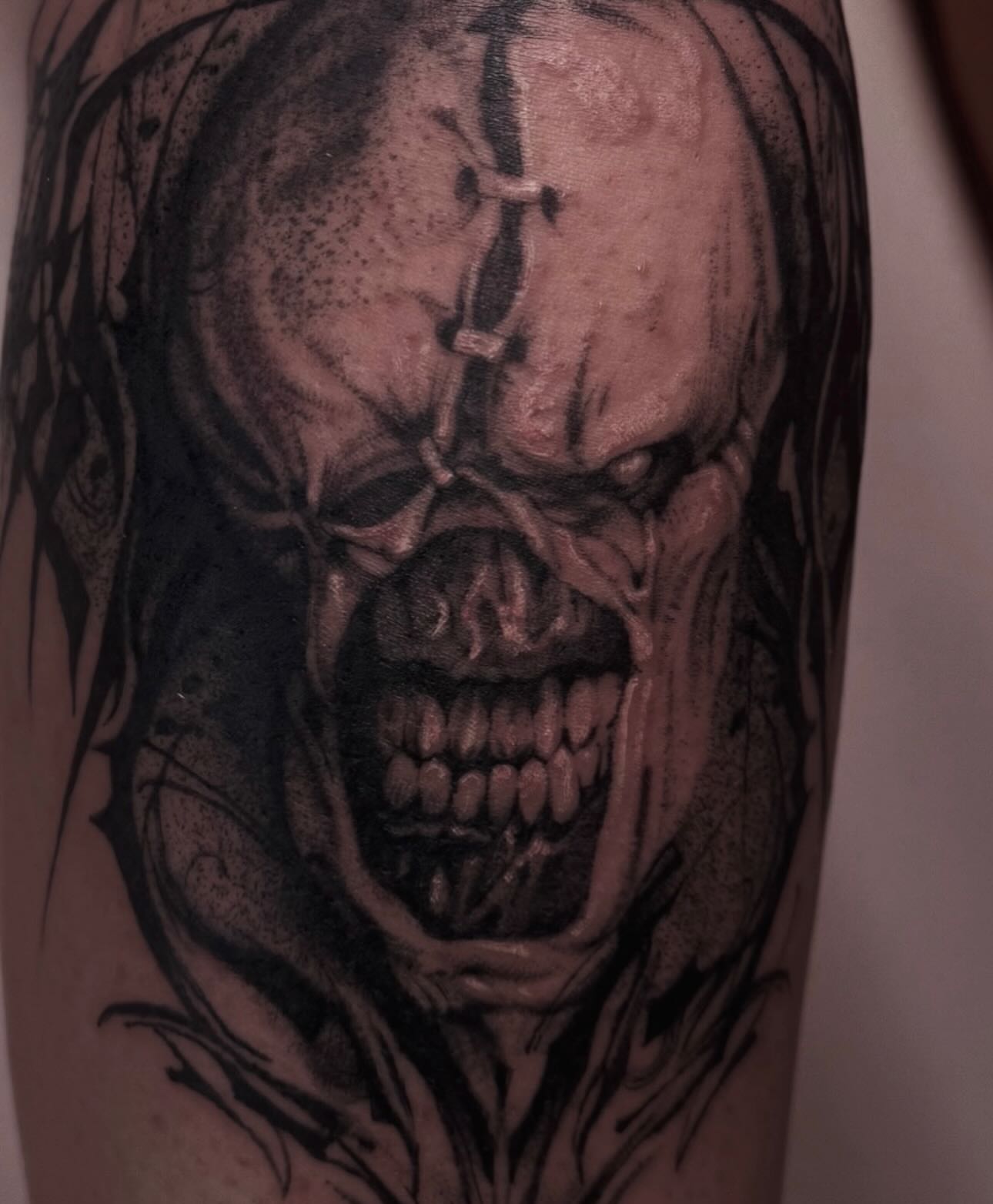 Horror skull dark realism tattoo on the forearm by Claire Litsey