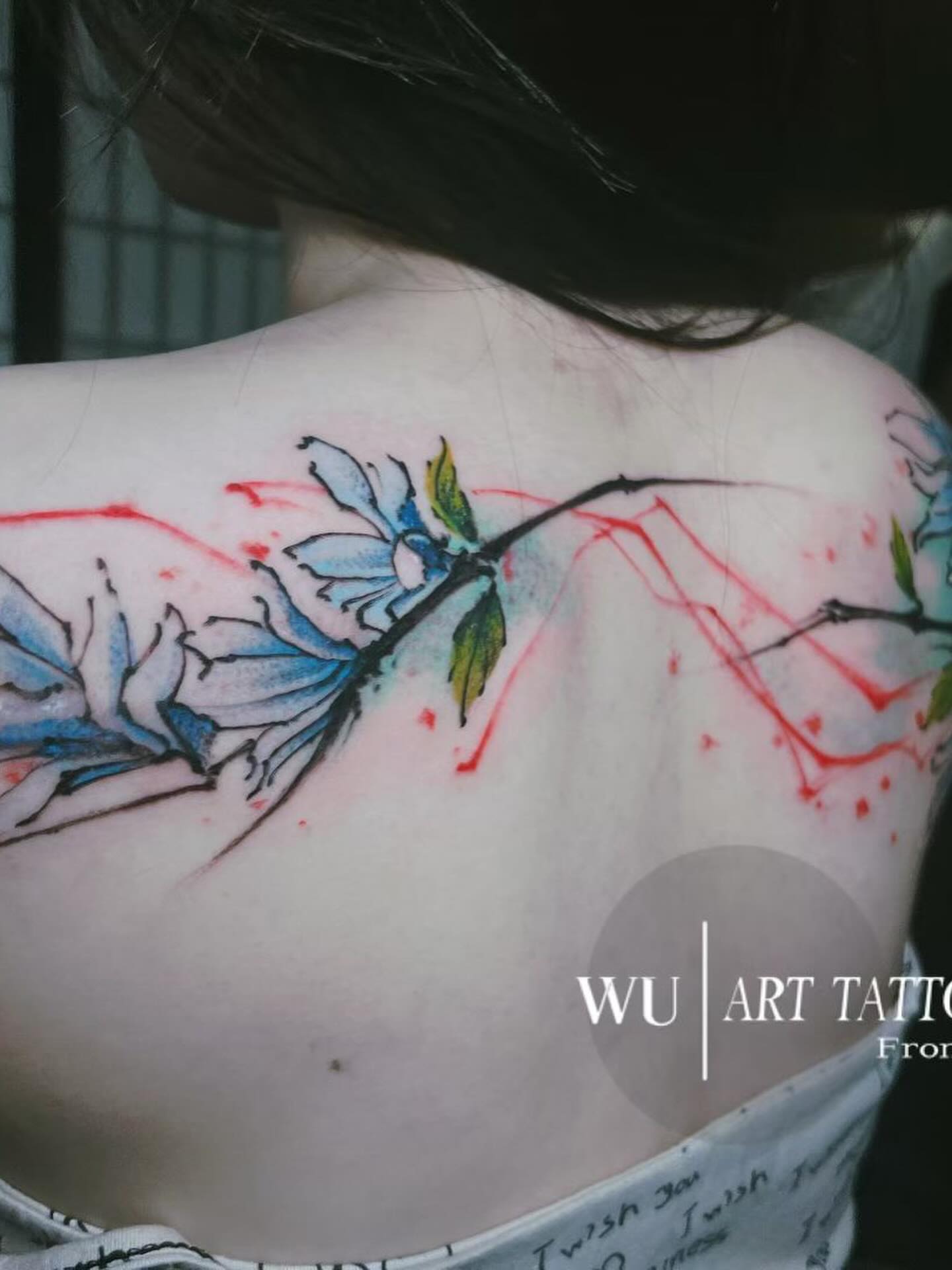 Flower branch watercolor tattoo on the back by Ink _daisy_