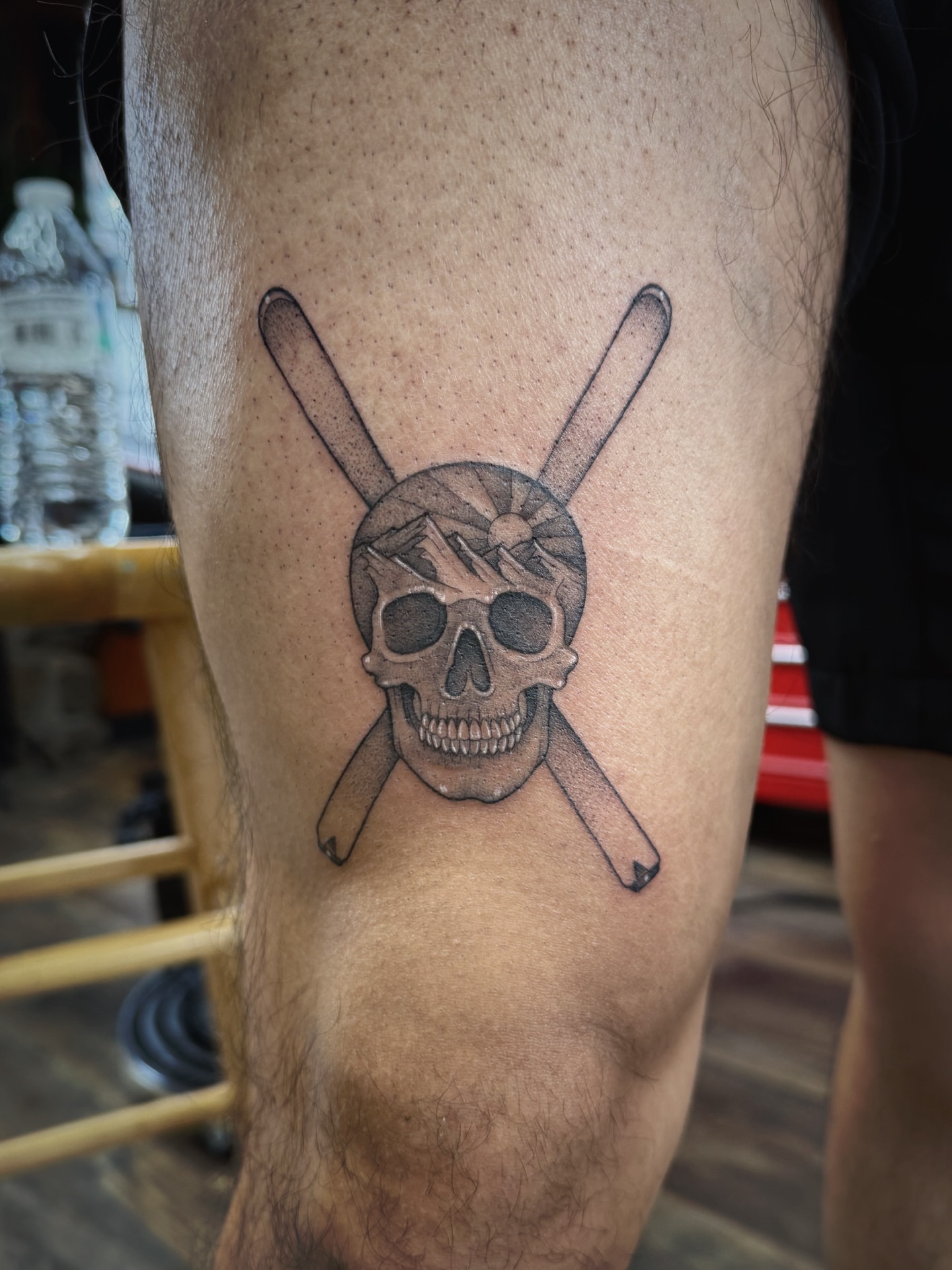 Skull and crossed bats black and grey tattoo on the thigh by Audrey