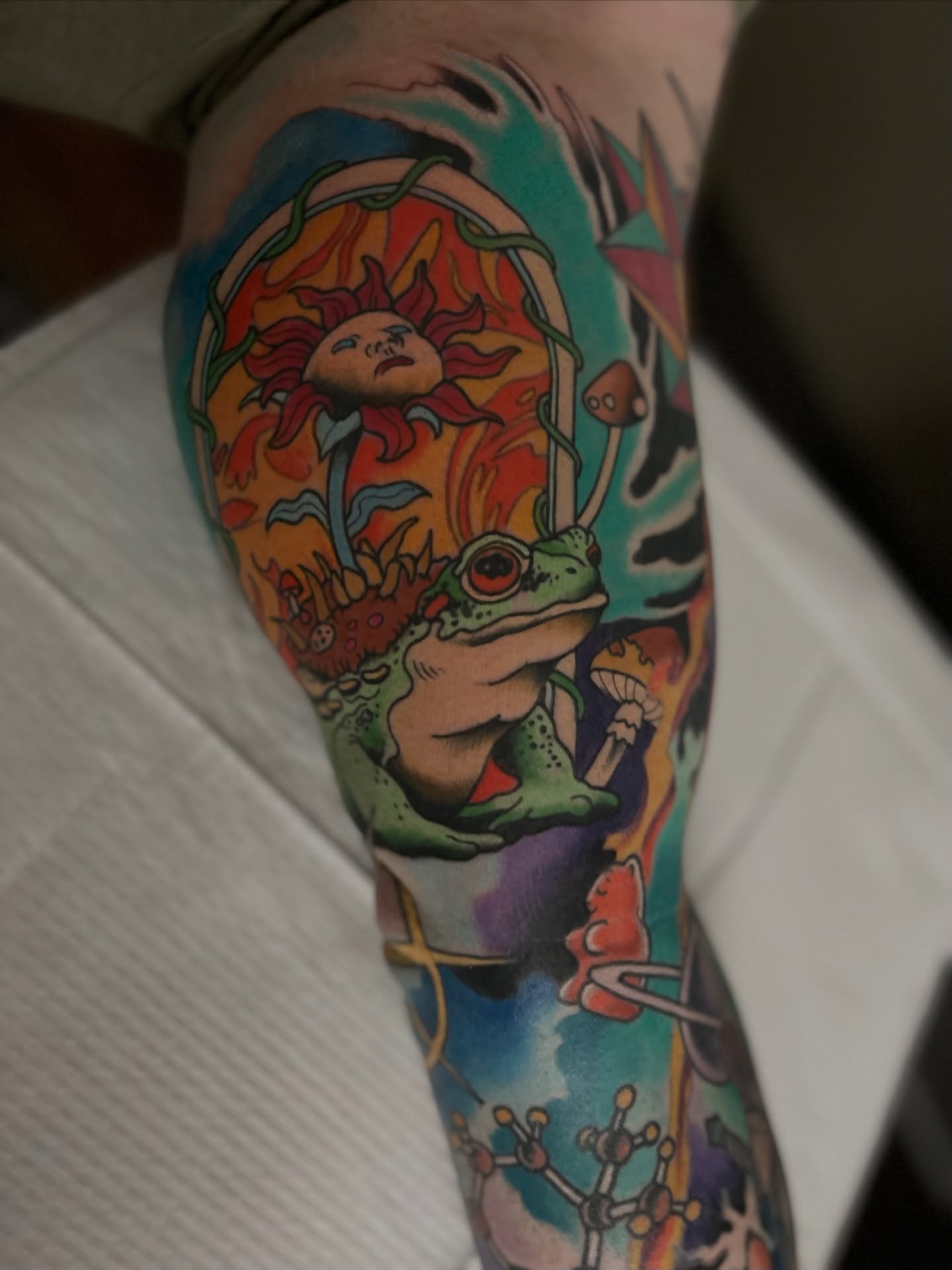 Frog and sun new school tattoo on the forearm by Jeremy Utley