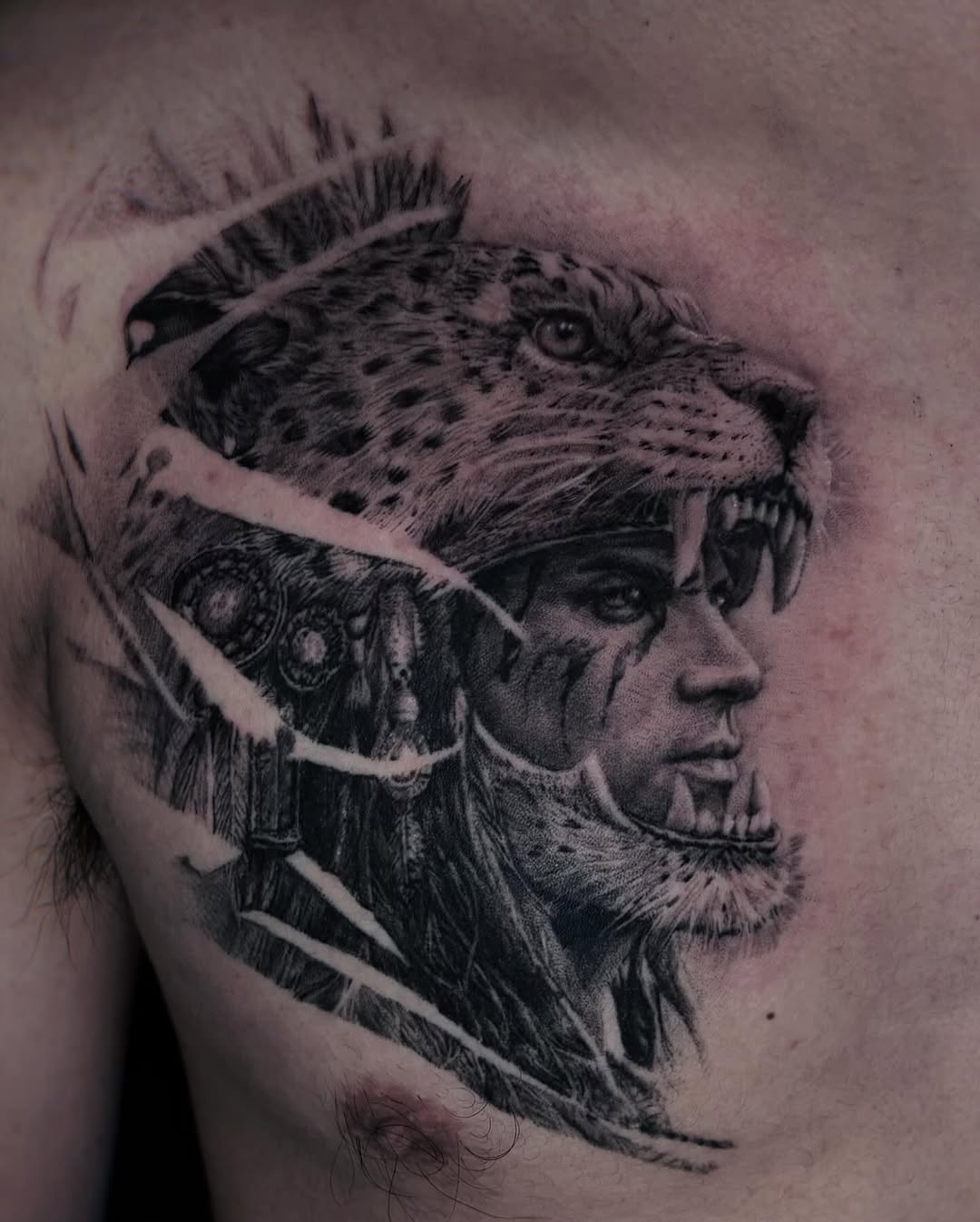 Man wearing jaguar headdress realism tattoo on the chest by Yu Chen