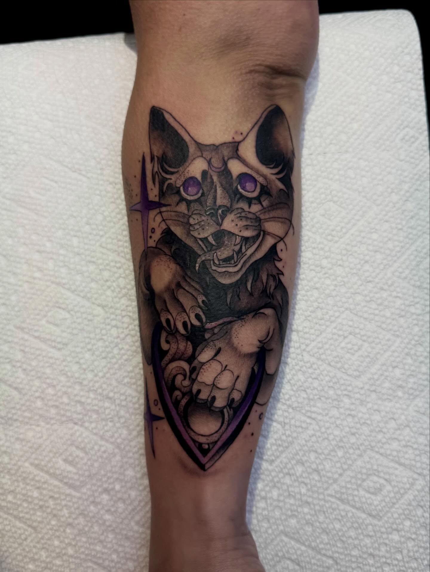 Cat dark realism tattoo on the forearm by Kalina Lynn