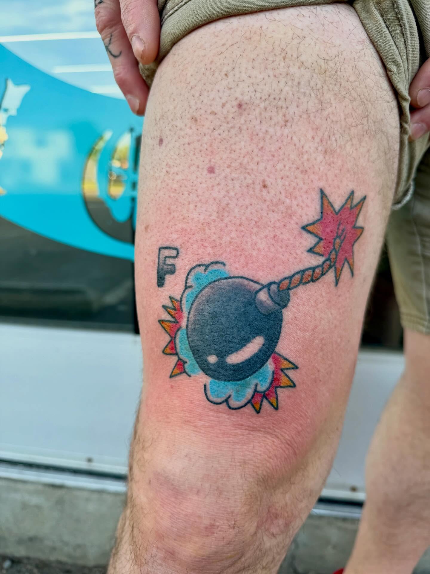 Bomb American traditional tattoo on the thigh by Ali Calis