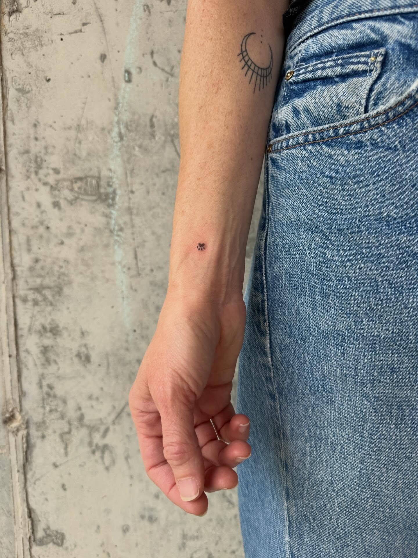 Sun and crescent moon dotwork tattoo on the forearm by springgreens