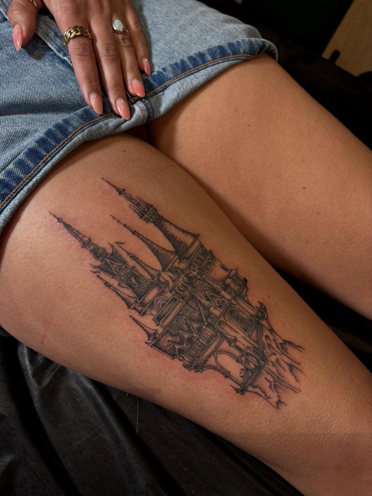 Castle black and grey tattoo on the thigh by Alyssa L'Heureux🕴🏼, Los Angeles, California