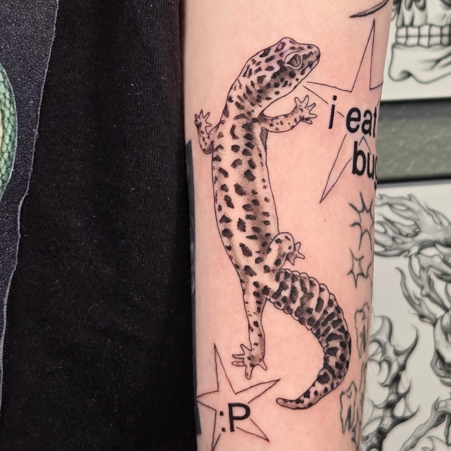 Gecko black and grey tattoo on the forearm by alec