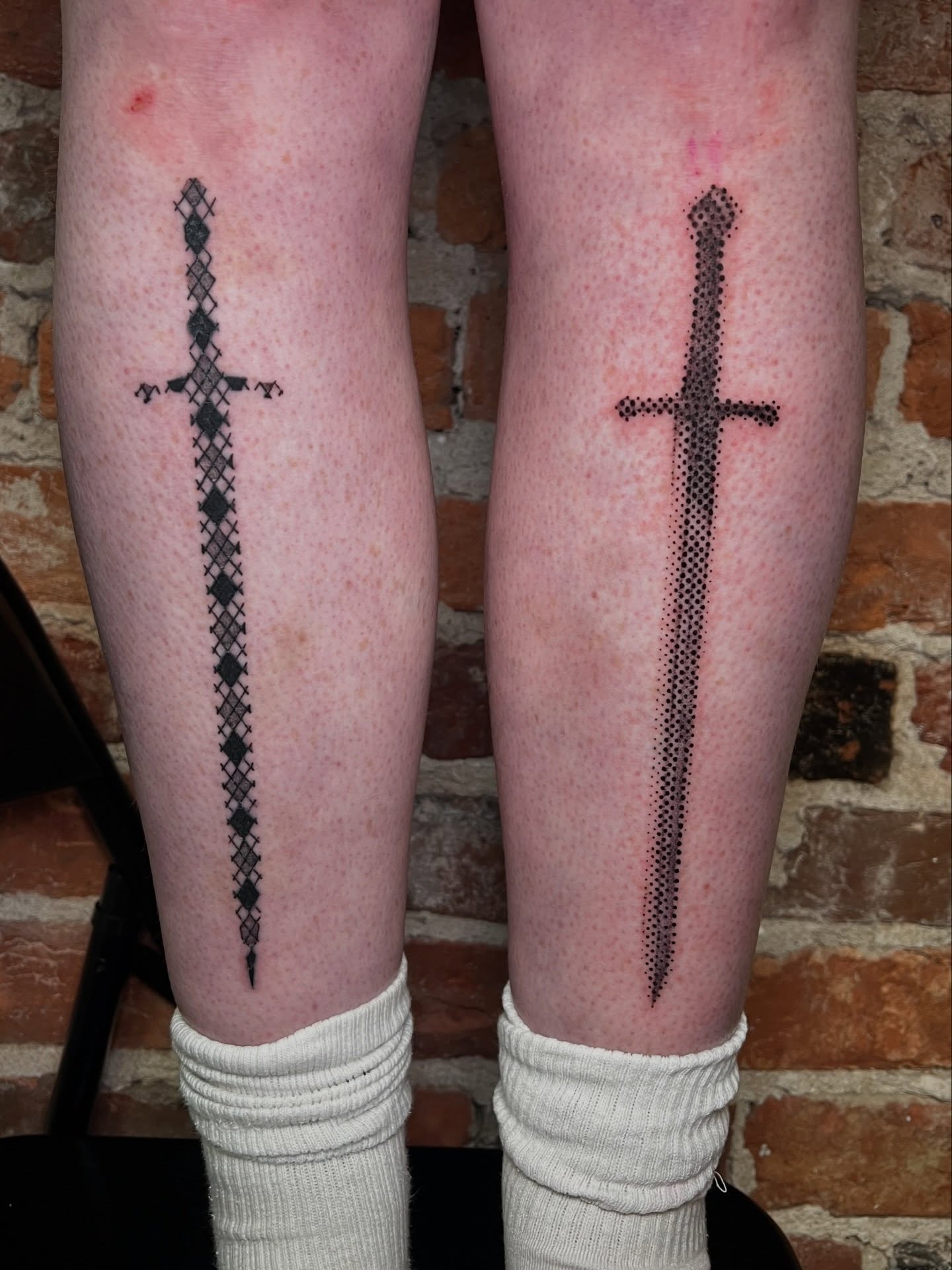 Sword dotwork tattoo on the leg by Uncomfy Comfort Tattoos LLC