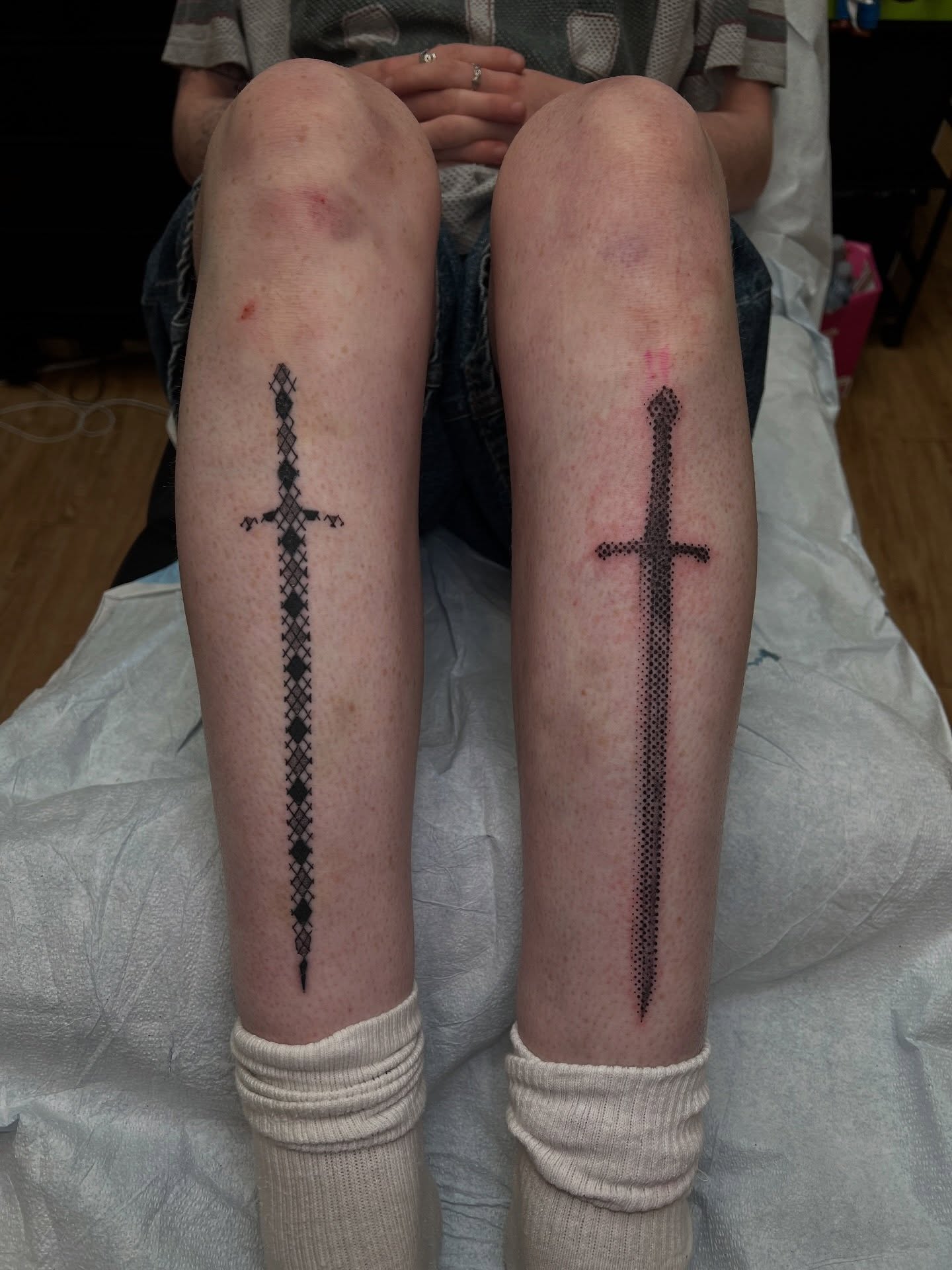 Sword blackwork tattoo on the calf by Uncomfy Comfort Tattoos LLC