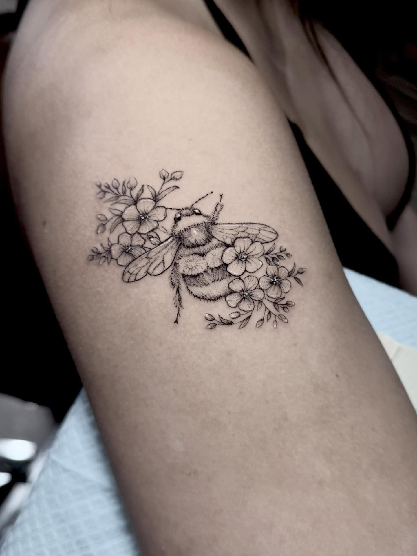 Bee and flowers realism tattoo on the forearm by Tattoos by Robyn Pallotta, Austin, Texas