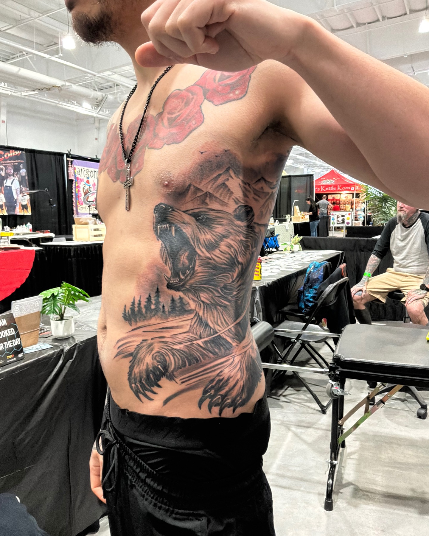 Bear and mountains realism tattoo on the chest by German Romero-Rendon