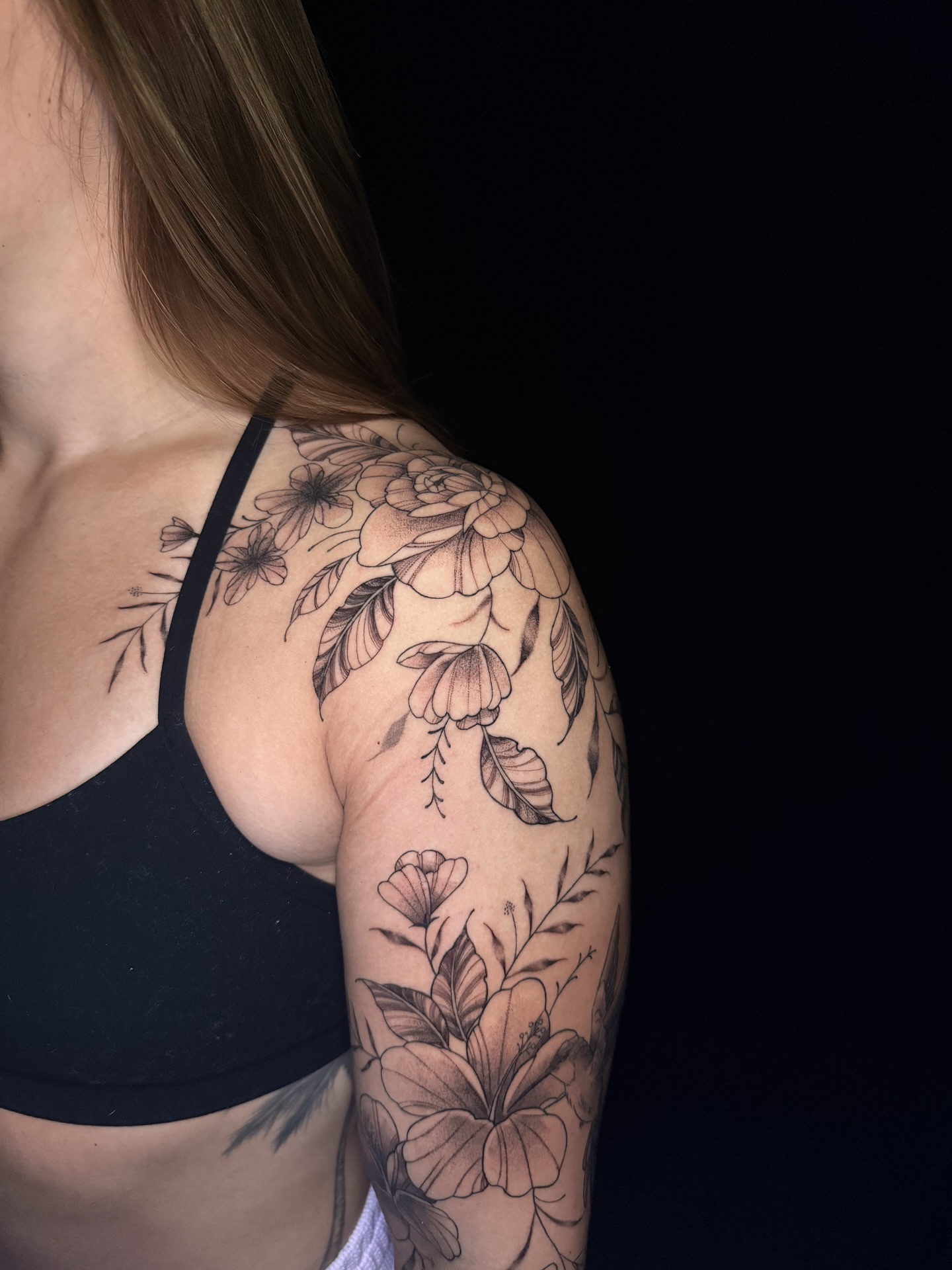 Floral arrangement black and grey tattoo on the shoulder by 𝕹𝖆𝖙