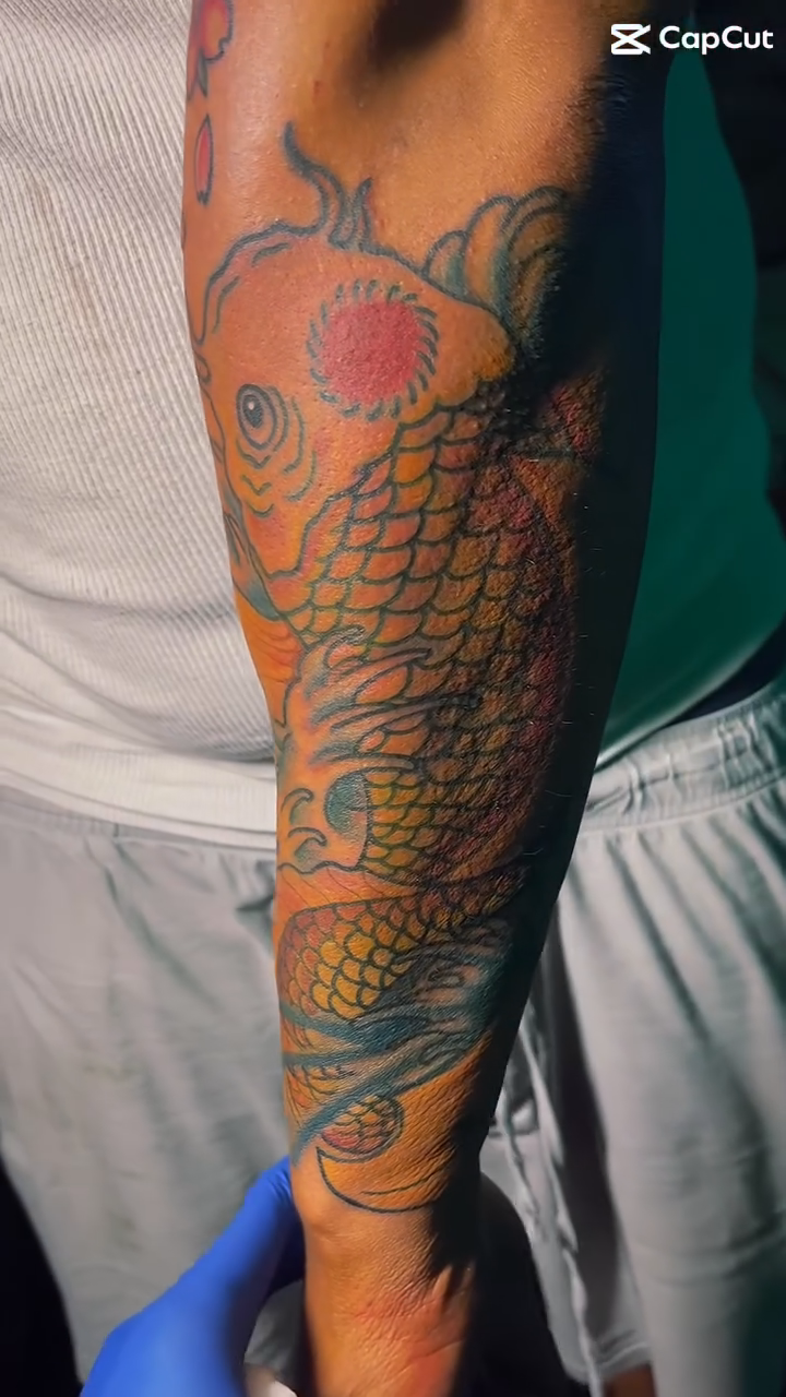 Koi fish and cherry blossoms japanese irezumi tattoo by Eli Flores