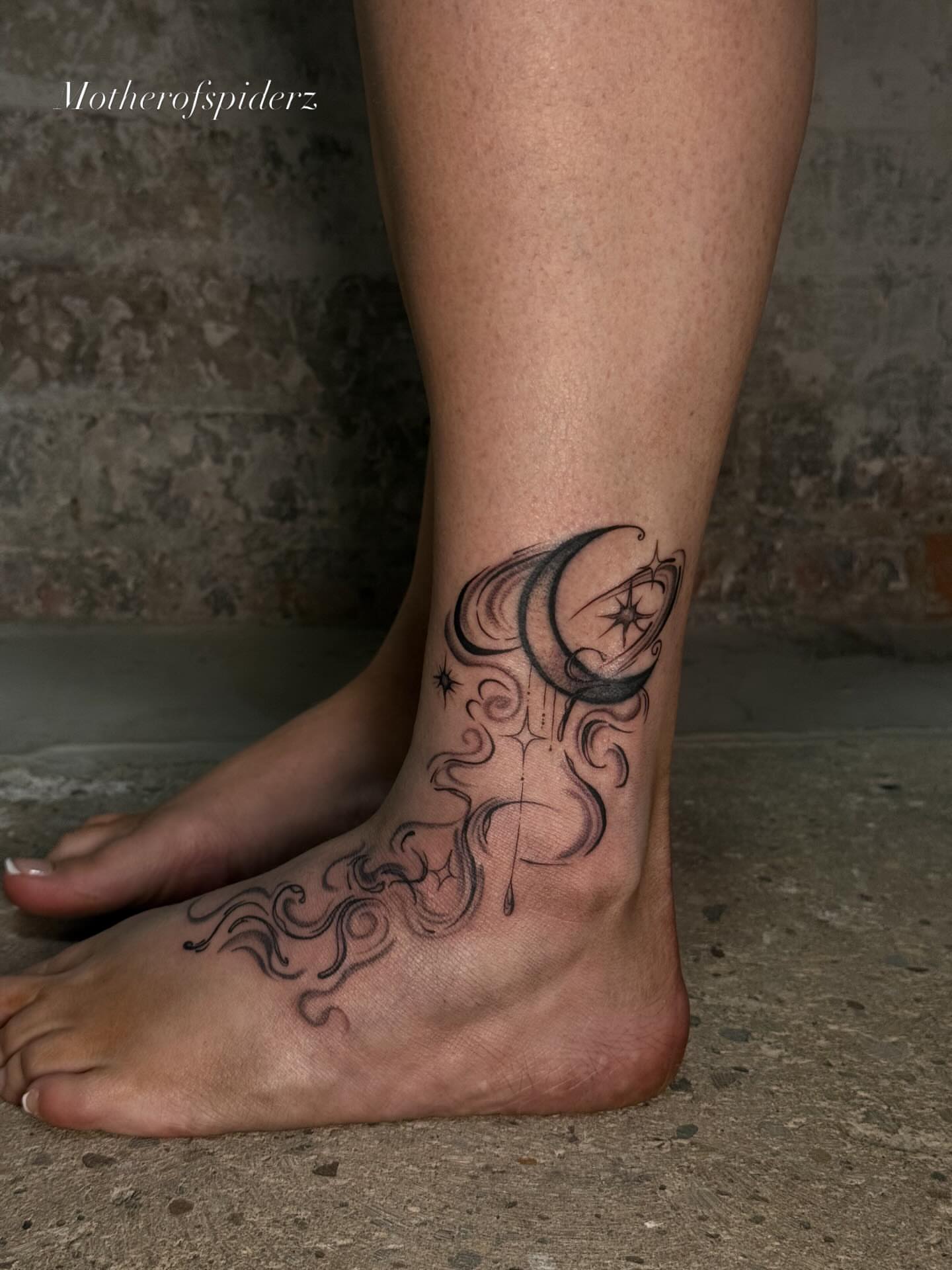 Moon and stars black and grey tattoo on the foot by Alyssa Garza