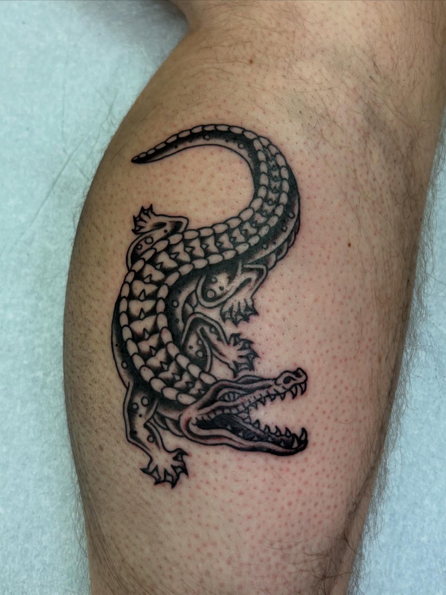 Alligator black and grey tattoo on the thigh by Jamie Yuu, Minneapolis, Minnesota