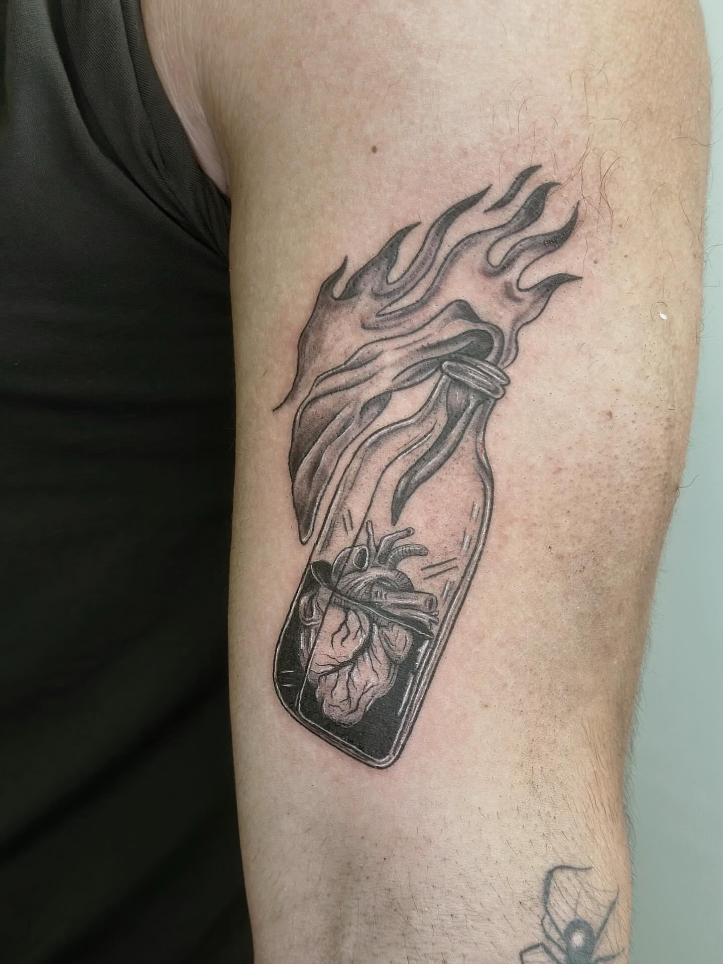 Heart in jar realism tattoo on the forearm by kenna