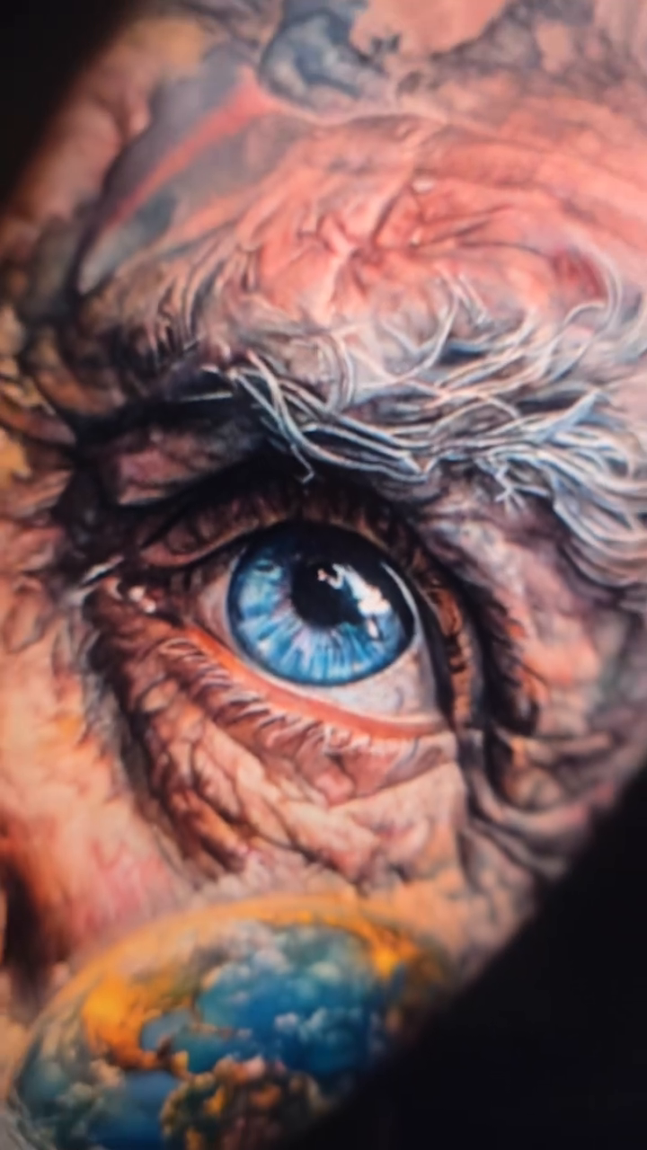 Old man's face with globe realism tattoo by Xavier NYC TATTOO ARTIST