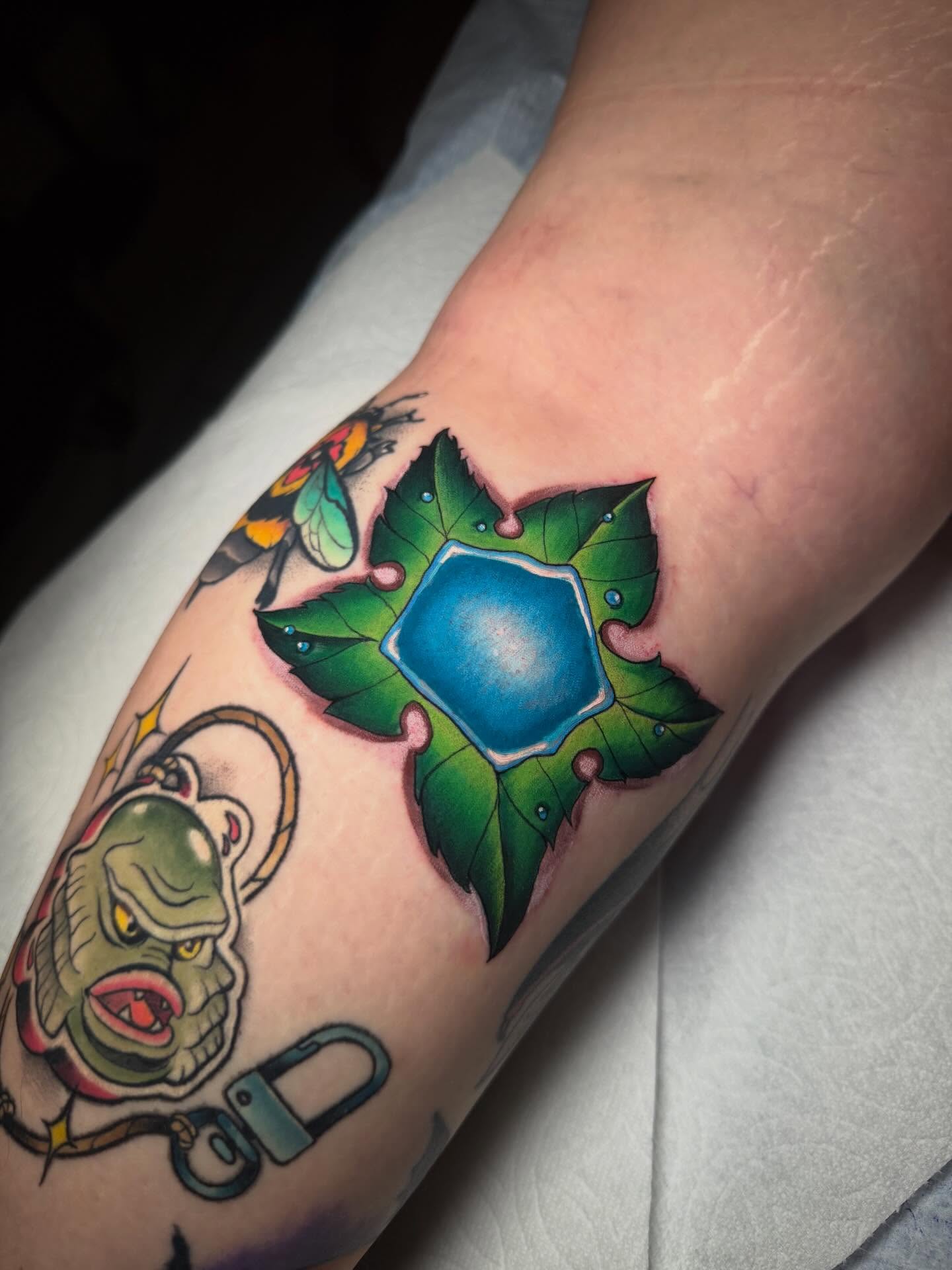 Ivy and pentacle American traditional tattoo on the forearm by Kenneth Ruiz