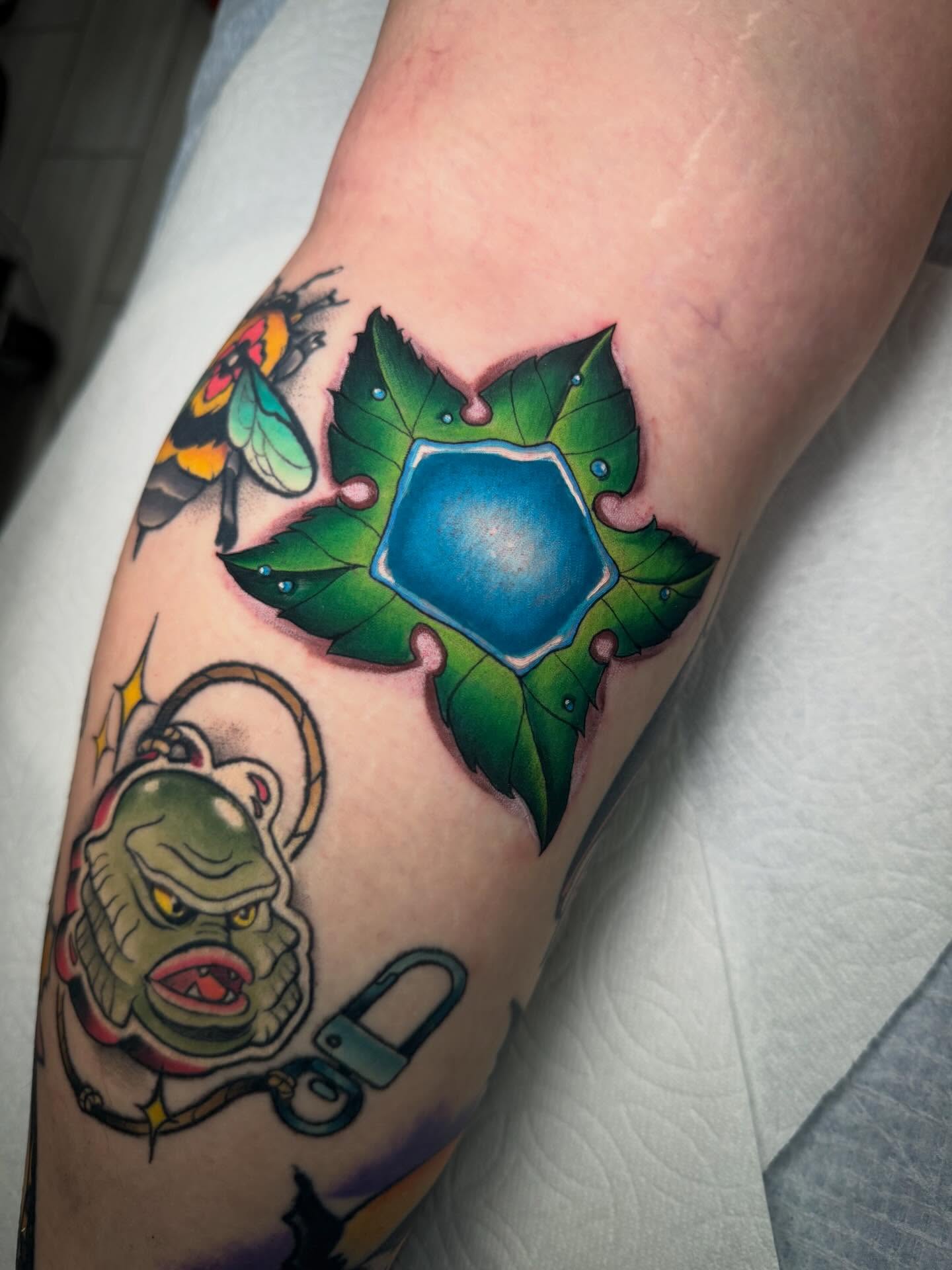 Ivy and pentacle American traditional tattoo on the forearm by Kenneth Ruiz