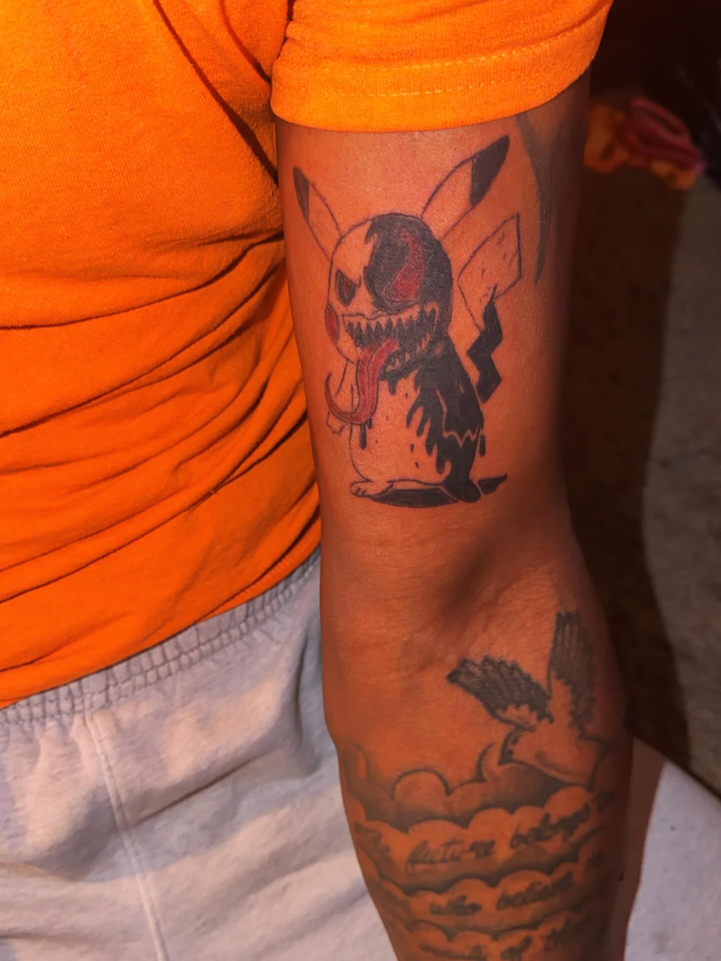 Pikachu trash polka tattoo on the forearm by @bloodline__legacy