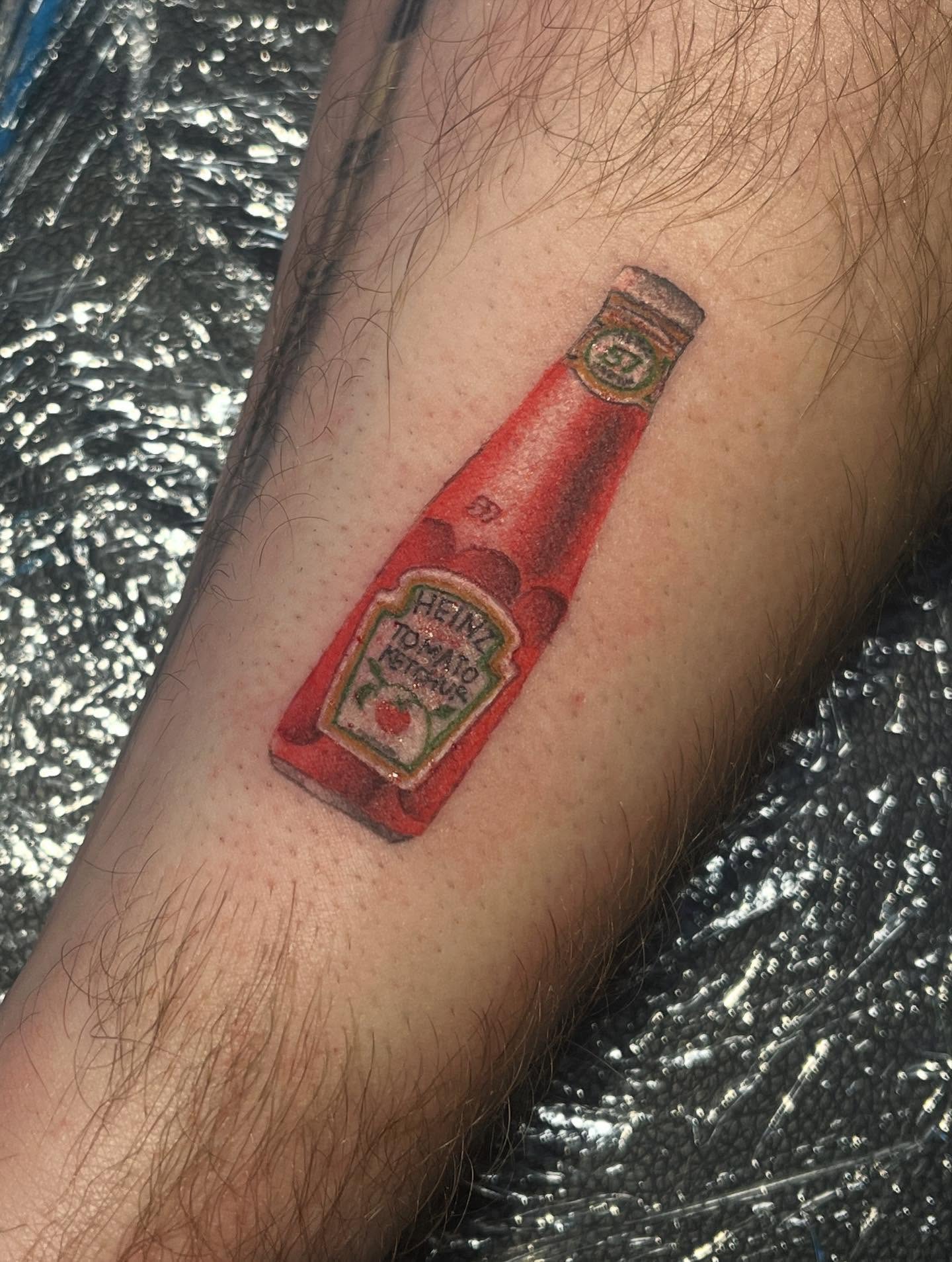 Heinz ketchup bottle realism tattoo on the forearm by 🖤Jess Pereira🖤, Framingham, Massachusetts