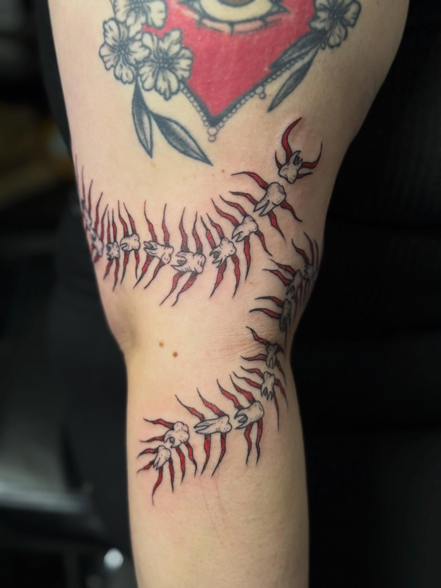 Spine with claws American traditional tattoo on the forearm by Camryn Justice
