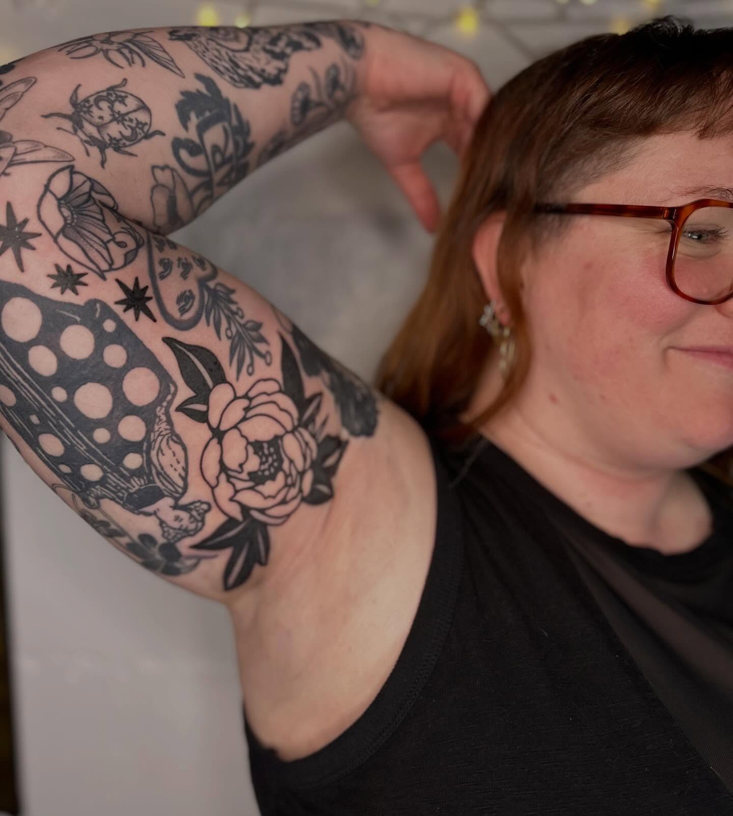 Peony and polka dots American traditional tattoo on the upper arm by mia palau