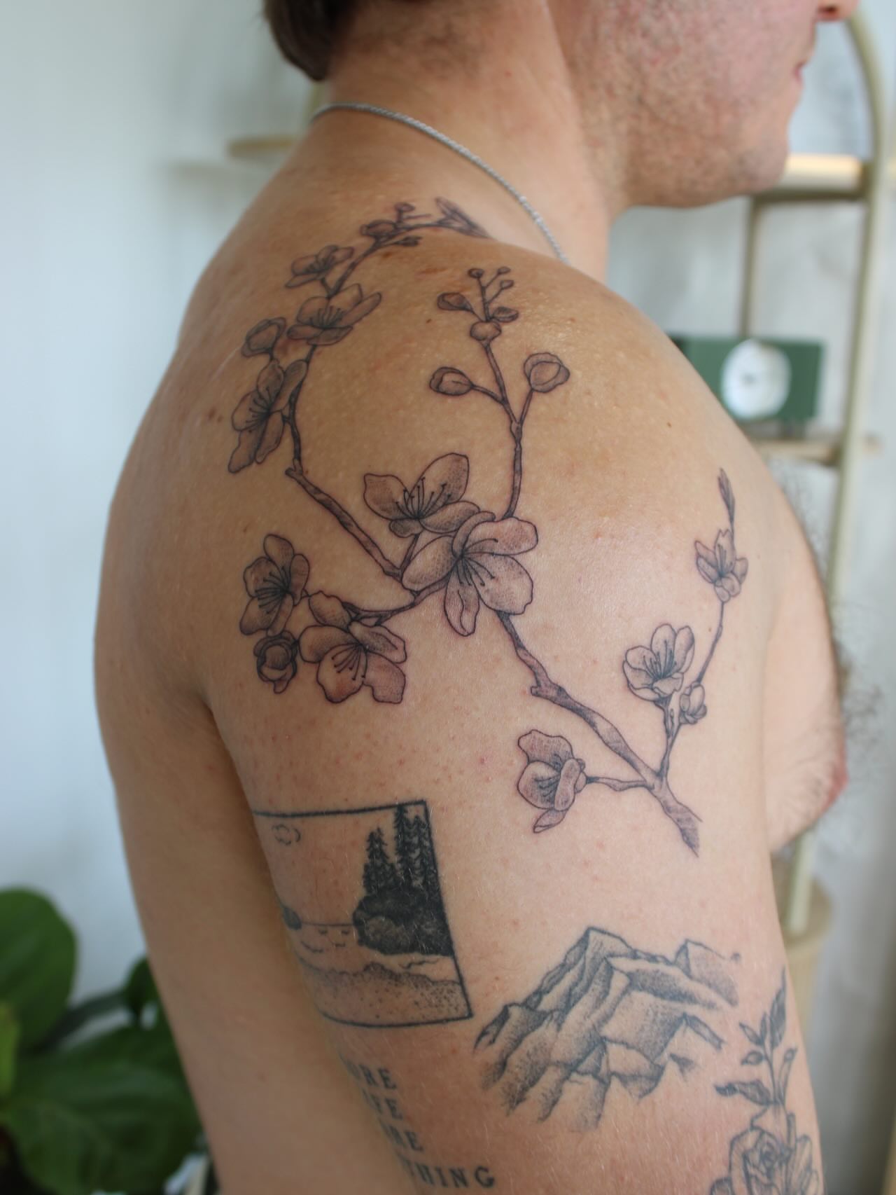 Cherry blossom branch black and grey tattoo on the shoulder by Priscila - HAWAII TATTOO