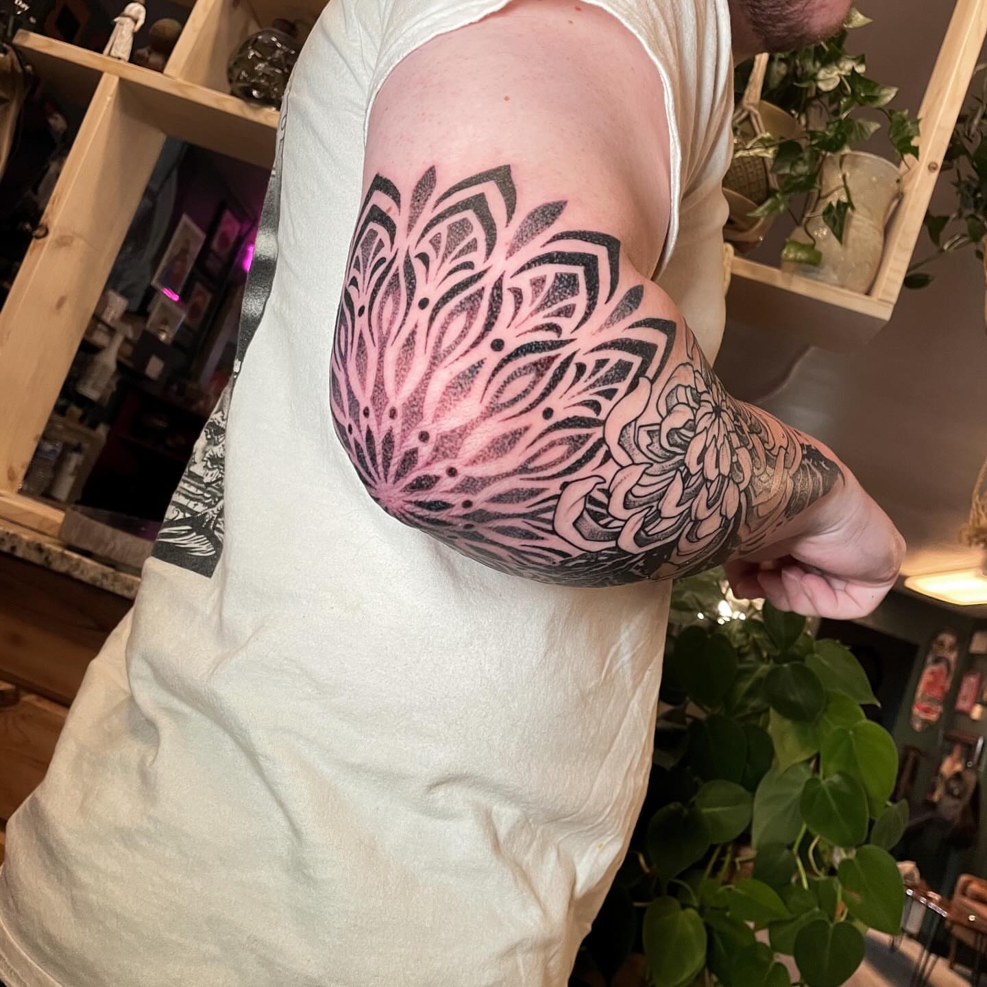Floral mandala dotwork tattoo on the forearm by Dev Z