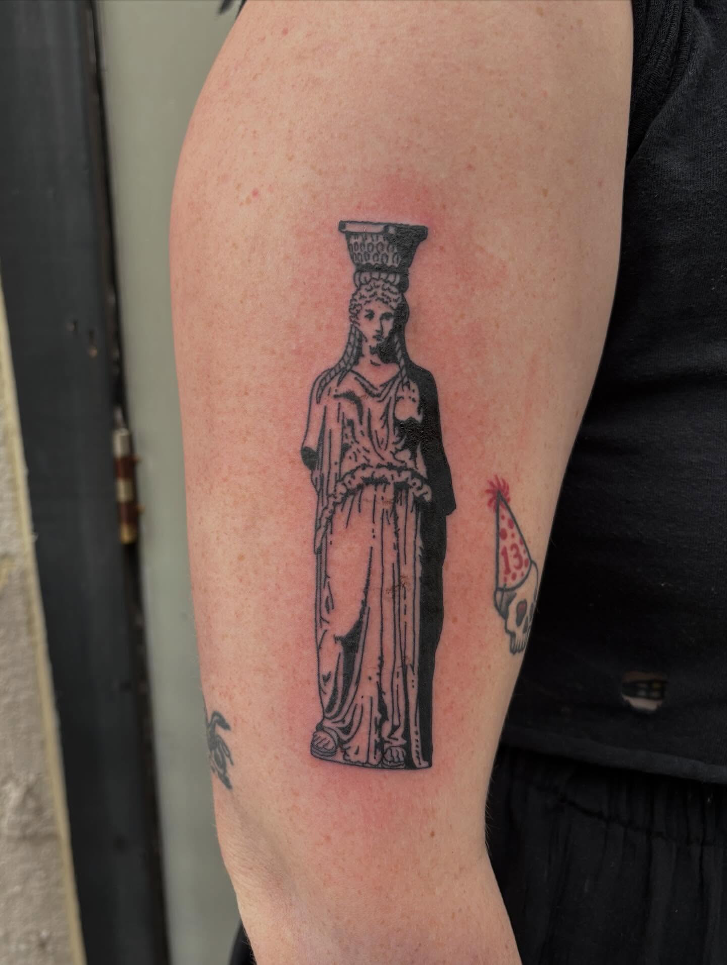 Statue of caryatid black and grey tattoo on the forearm by Turner