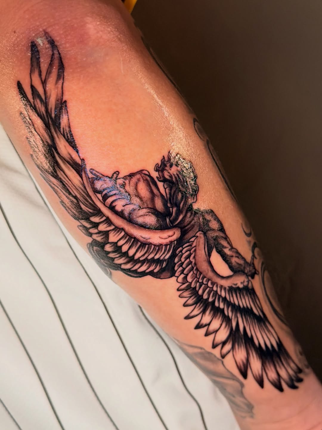 Angel with wings realism tattoo on the forearm by jayla pantig