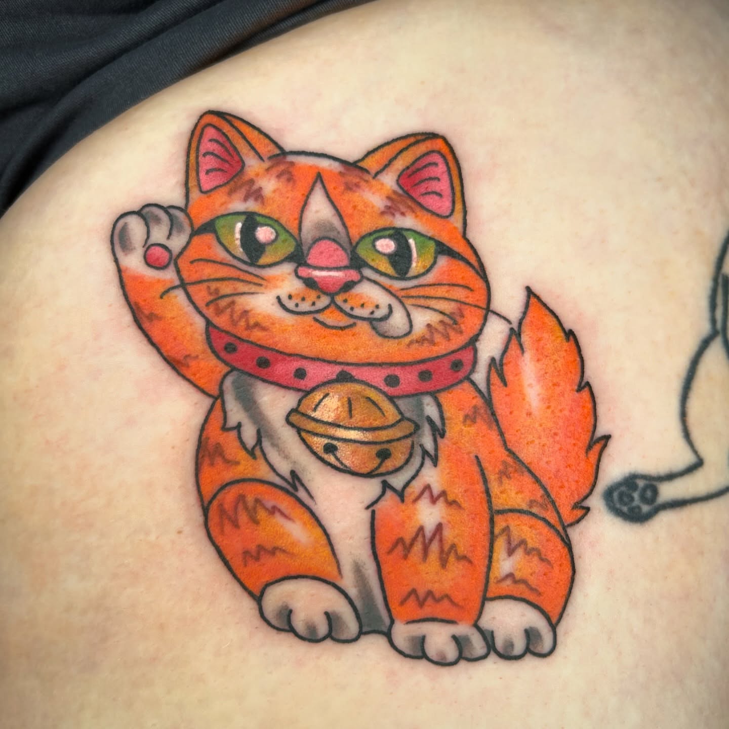 Cat American traditional tattoo on the thigh by Audrey Migitsch