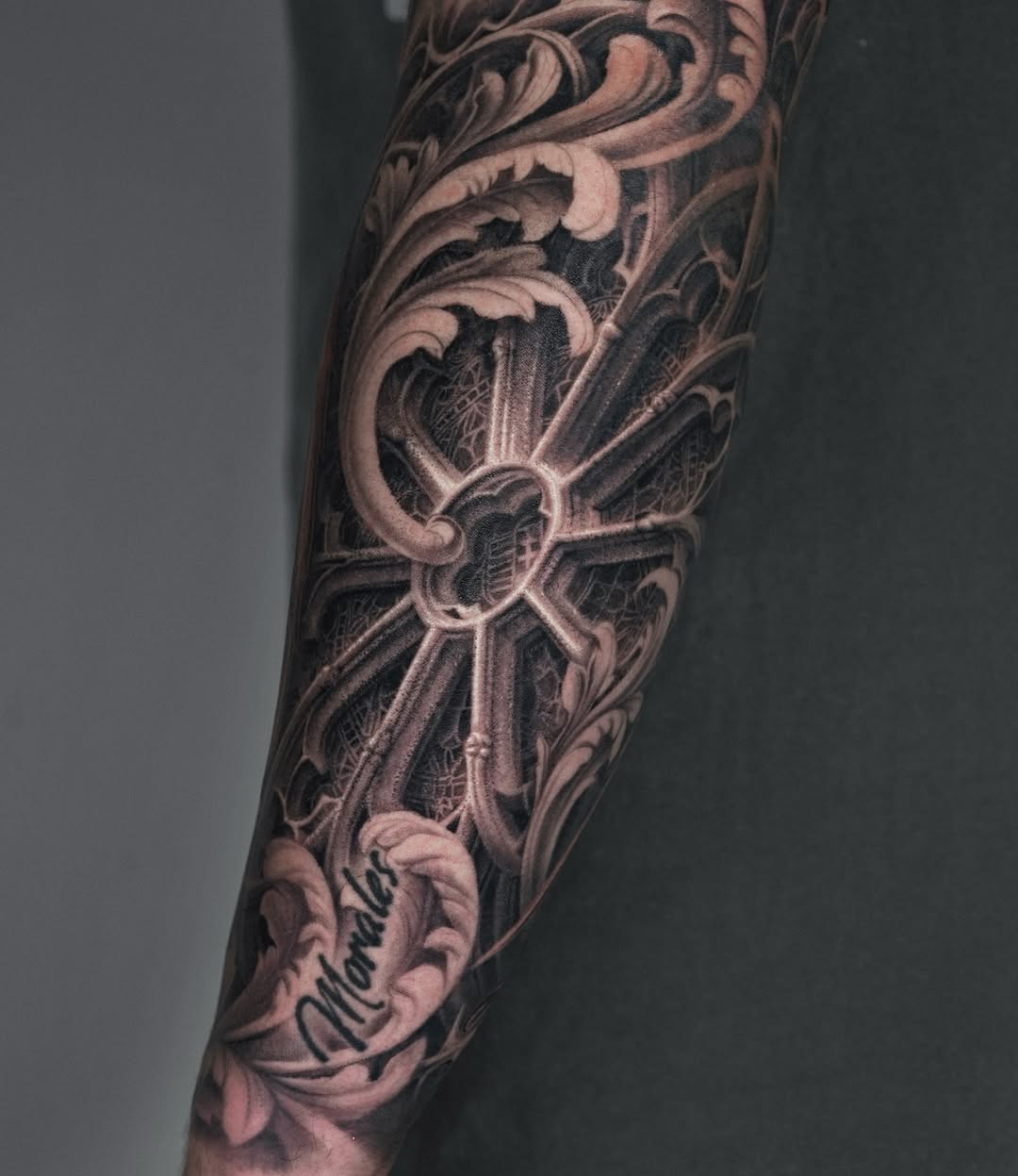 Ornamental window with script Chicano tattoo on the forearm by Sumok Kim
