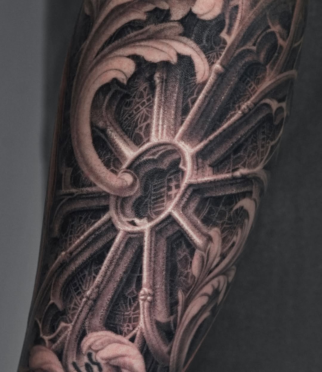 Ornate architectural element dark art tattoo on the forearm by Sumok Kim