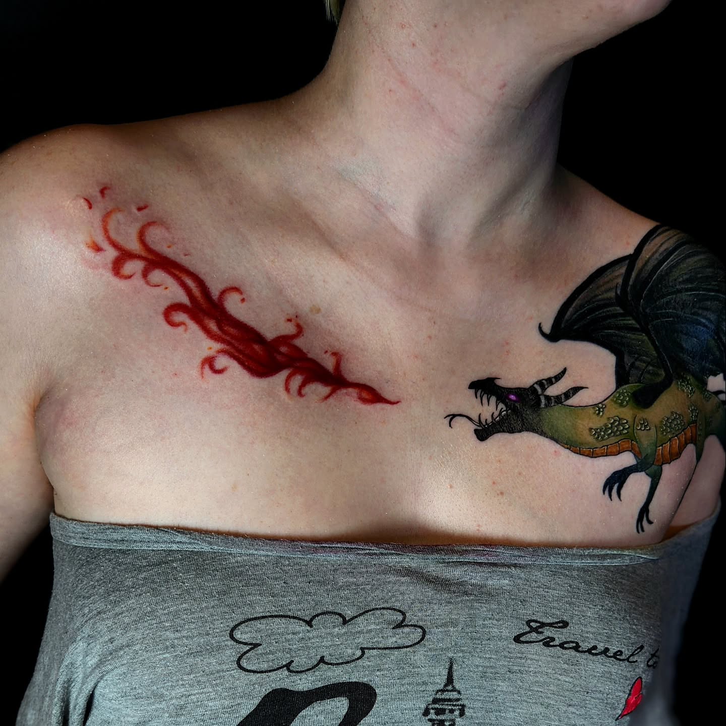 Squid and dragon new school tattoo on the chest by Ashly Renee