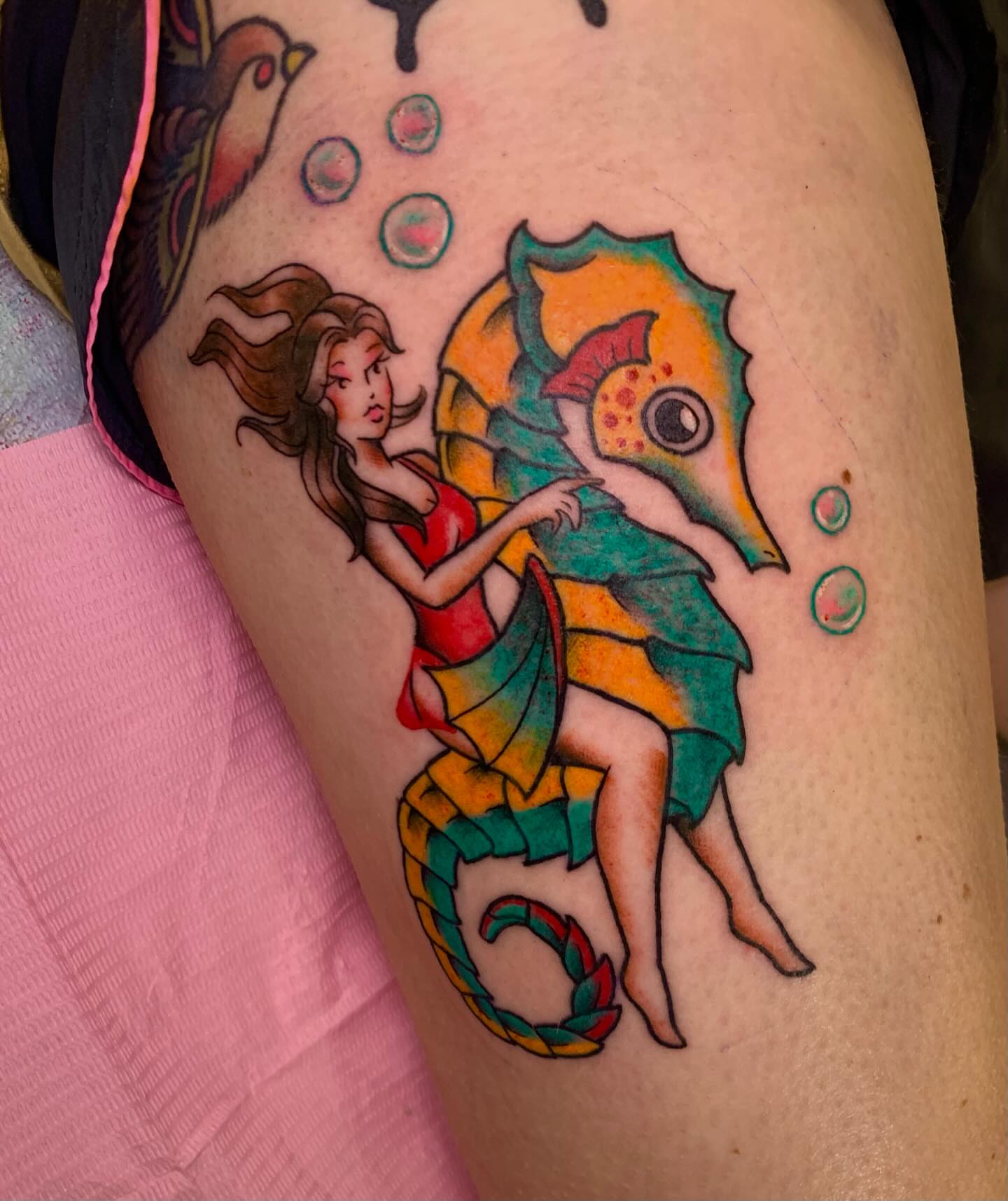 Mermaid riding seahorse new school tattoo on the thigh by Hannah Hahn